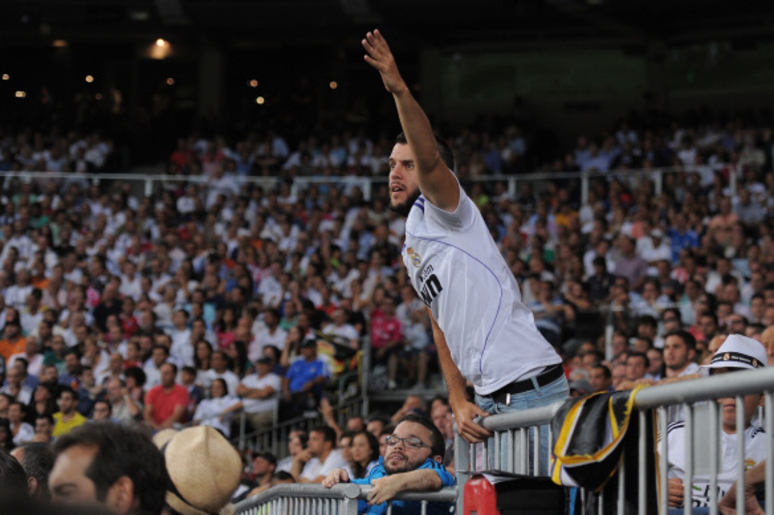 MADRID, SPAIN - SEPTEMBER 13:  A Real Madrid fan reacts during the La Liga match between Real Madrid and Atletico de Madrid at Estadio Santiago Bernabeu on September 13, 2014 in Madrid, Spain.   Real lost the match 2-1. (Photo by Denis Doyle/Getty Images)