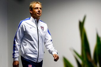 SALVADOR, BRAZIL - JUNE 30:  Head coach Jurgen Klinsmann of the United States enters the room to speak to the media during a press conference at Arena Fonte Nova on June 30, 2014 in Salvador, Brazil.  (Photo by Kevin C. Cox/Getty Images)