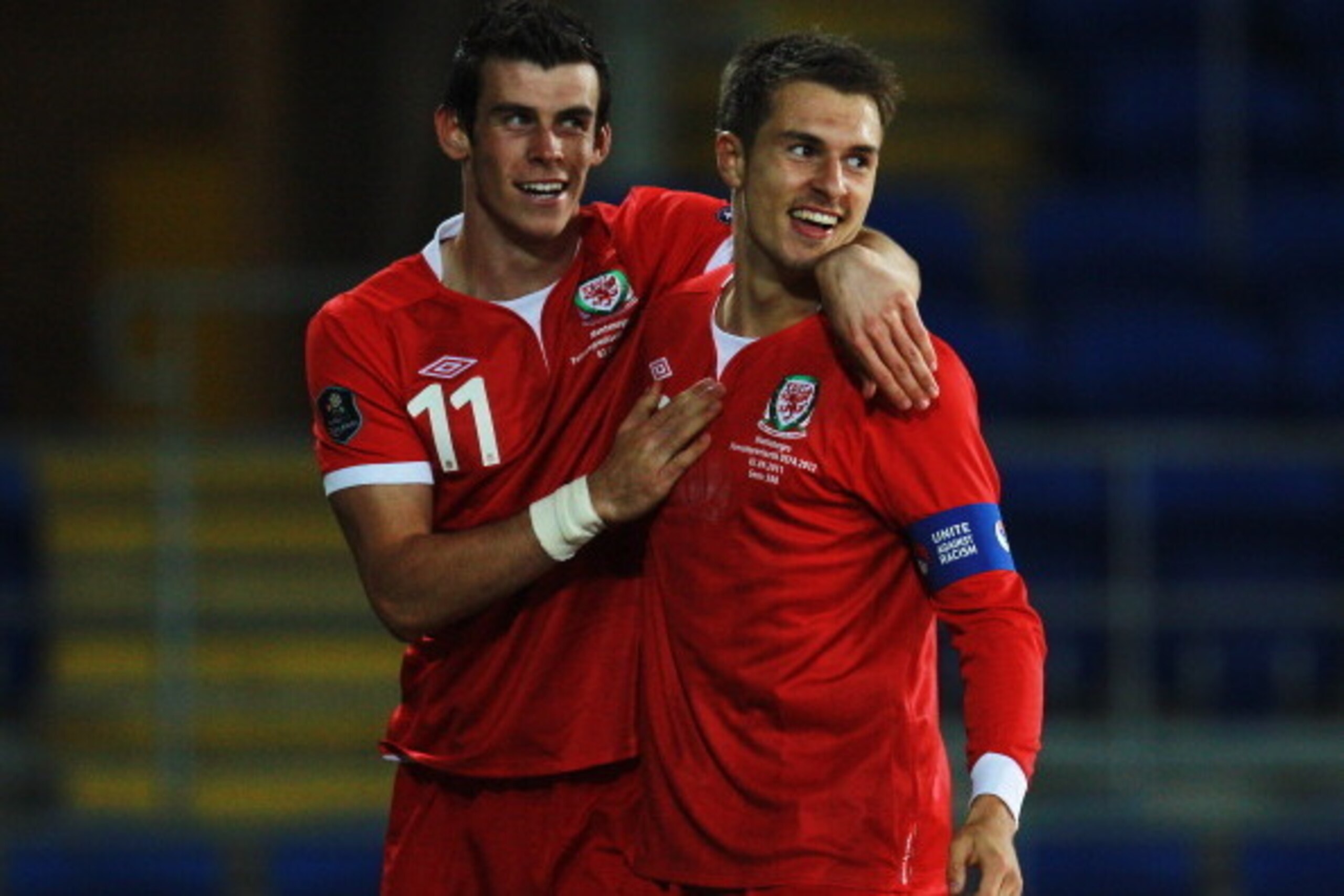 CARDIFF, WALES - SEPTEMBER 02:  Aaron Ramsey (R) of Wales celebrates with team mate Gareth Bale (L) after scoring his sides second goal during the UEFA EURO 2012 group G qualifying match between Wales and Montenegro at the Cardiff City Stadium on Septembe