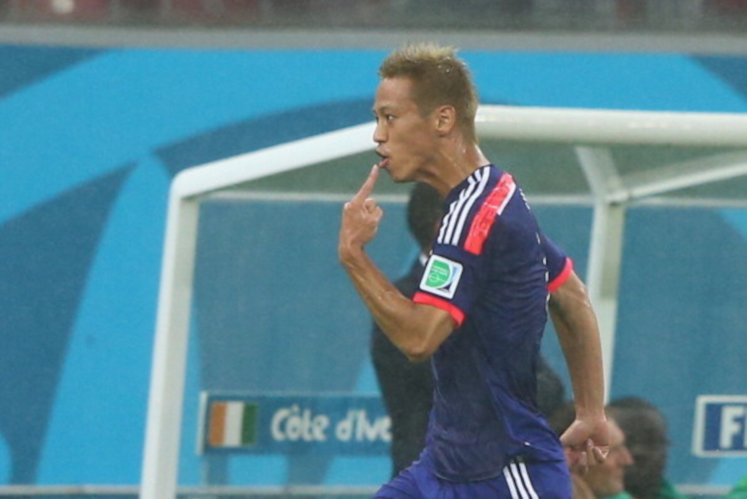RECIFE, BRAZIL - JUNE 14: Keisuke Honda of Japan celebrates scoring his team's first goal during the 2014 FIFA World Cup Brazil Group C match  between the Ivory Coast and Japan at Arena Pernambuco on June 14, 2014 in Recife, Brazil.  (Photo by Jamie Squir
