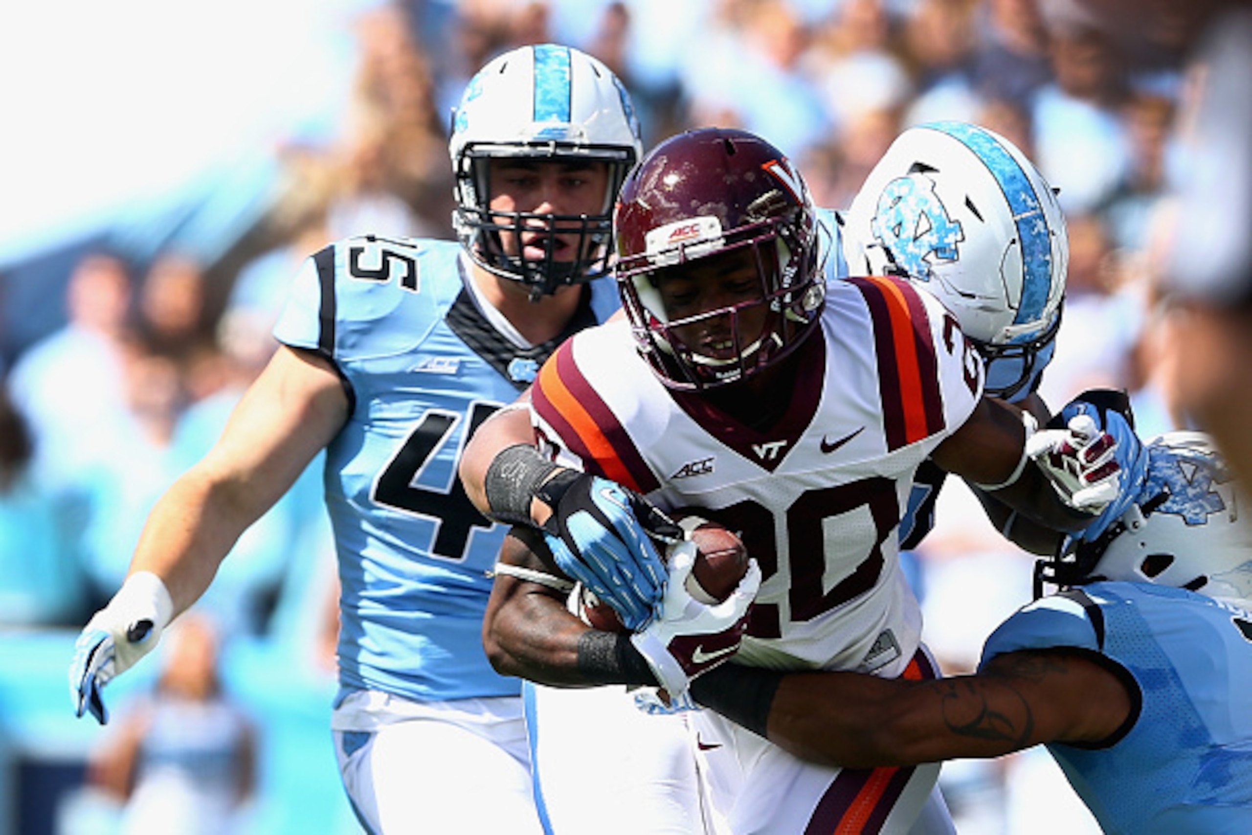 CHAPEL HILL, NC - OCTOBER 04:  Deon Newsome #20 of the Virginia Tech Hokies runs with the ball against the defense of the North Carolina Tar Heels during their game at Kenan Stadium on October 4, 2014 in Chapel Hill, North Carolina.  (Photo by Streeter Le