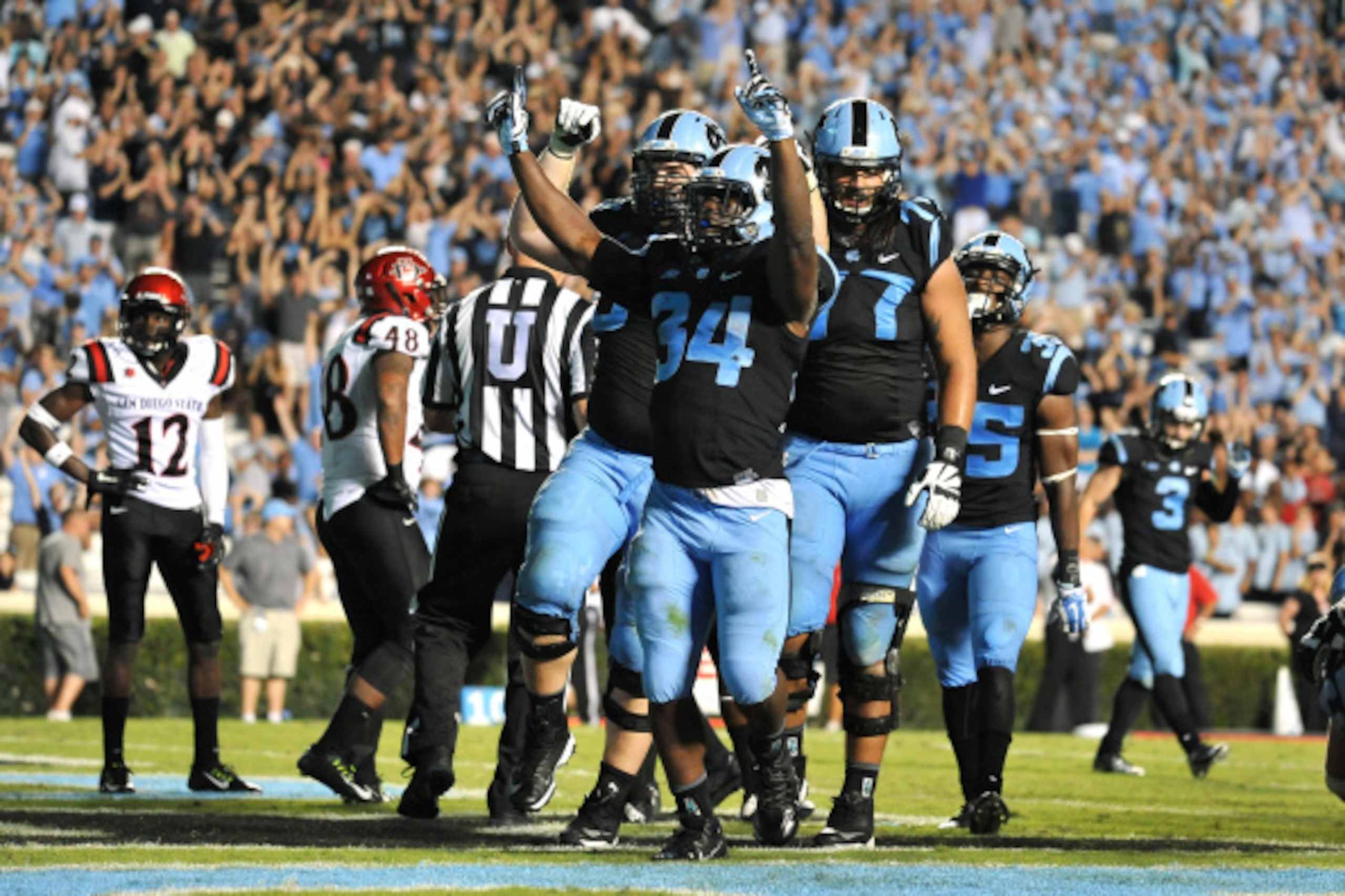 CHAPEL HILL, NC - SEPTEMBER 06: Elijah Hood #34 of the North Carolina Tar Heels celebrates following a 2-yard touchdown run during their game against the San Diego State Aztecs on September 6, 2014 at Kenan Stadium in Chapel Hill, North Carolina. North Ca