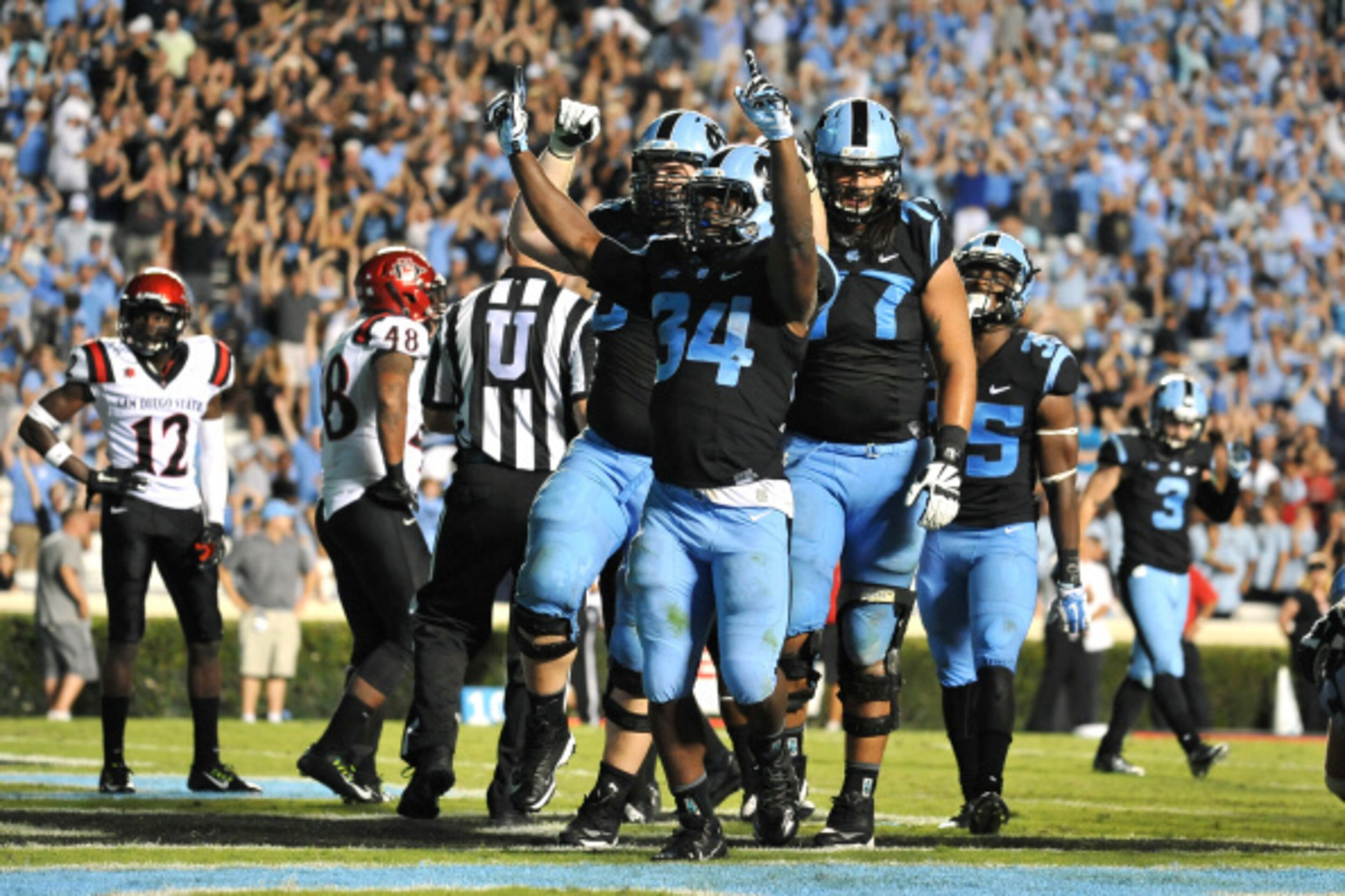 CHAPEL HILL, NC - SEPTEMBER 06: Elijah Hood #34 of the North Carolina Tar Heels celebrates following a 2-yard touchdown run during their game against the San Diego State Aztecs on September 6, 2014 at Kenan Stadium in Chapel Hill, North Carolina. North Ca