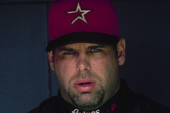 PITTSBURGH - APRIL 6:  Ken Caminiti #11 of the Houston Astros looks on from the dugout during their MLB game against the Pittsburgh Pirates on April 6, 2000 at Three Rivers Stadium in Pittsburgh, Pennsylvania. (Photo by Rick Stewart/Getty Images)