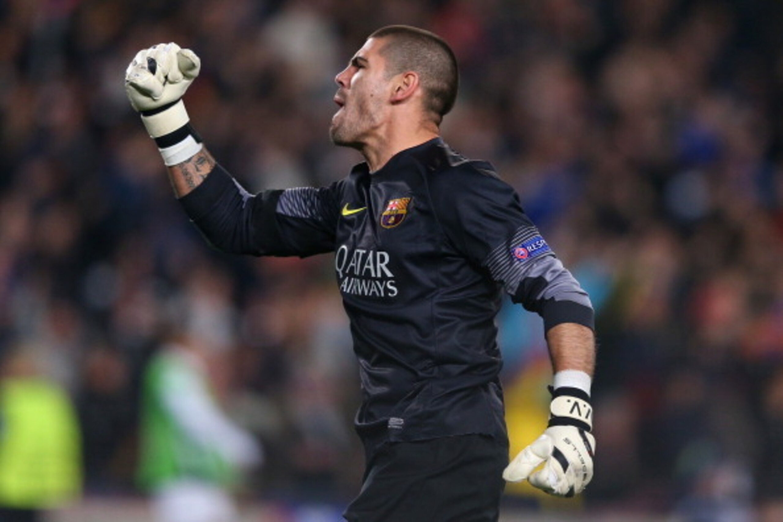 BARCELONA, SPAIN - MARCH 12:  Victor Valdes of FC Barcelona celebrates the second goal during the UEFA Champions League Round of 16 match between FC Barcelona and Manchester City at Camp Nou on March 12, 2014 in Barcelona, Spain.  (Photo by Alex Livesey/G
