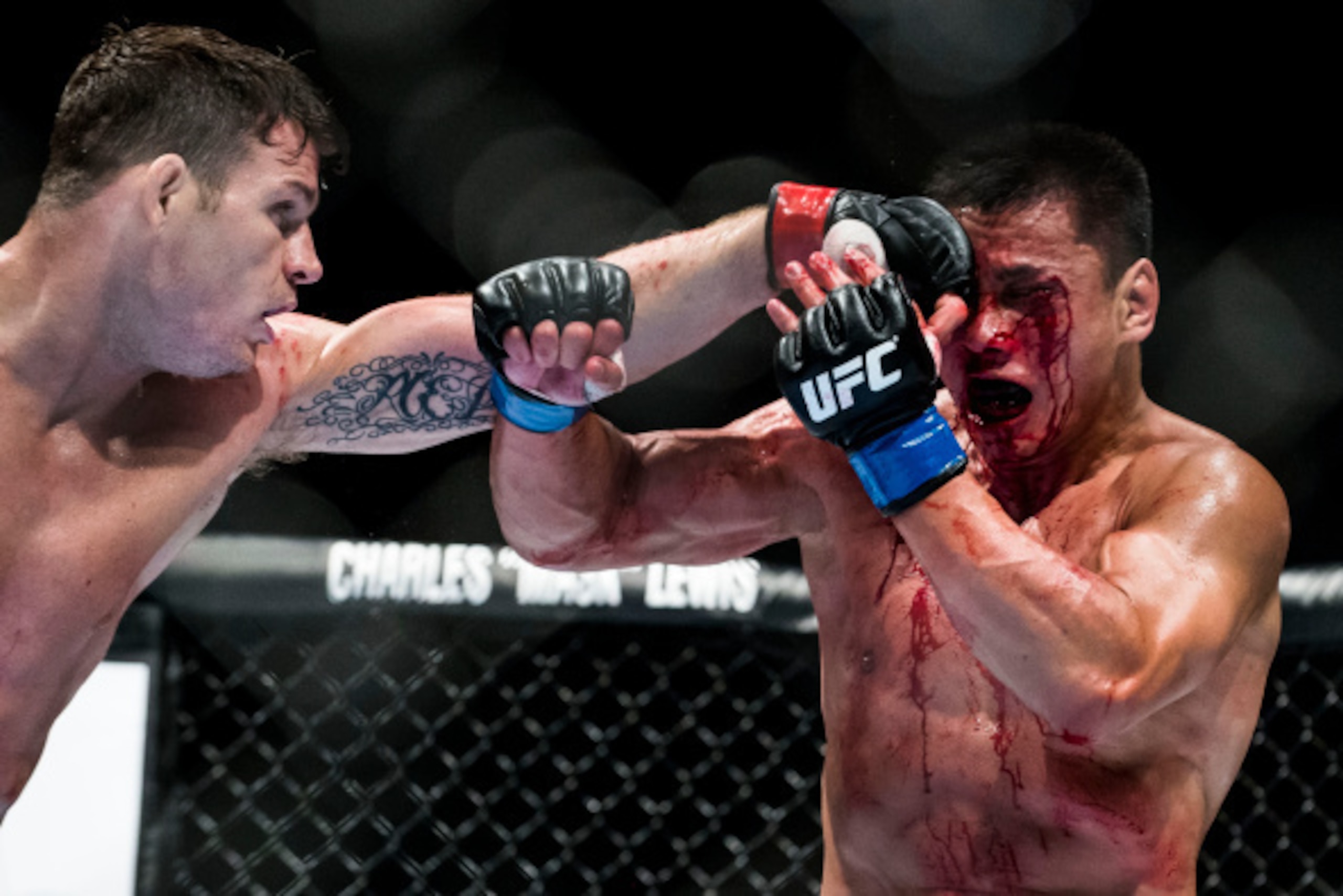 MACAU - AUGUST 23: Michael Bisping (L) of England punches Cung Le of USA on their 5-Round middleweight fight during the UFC Fight Night at The Venetian Macao Cotai Arena on August 23, 2014 in Macau, China. (Photo by Victor Fraile/Getty Images) MACAU - AUGUST 23: Michael Bisping (L) of England punches Cung Le of USA on their 5-Round middleweight fight during the UFC Fight Night at The Venetian Macao Cotai Arena on August 23, 2014 in Macau, China. (Photo by Victor Fraile/Getty Images)