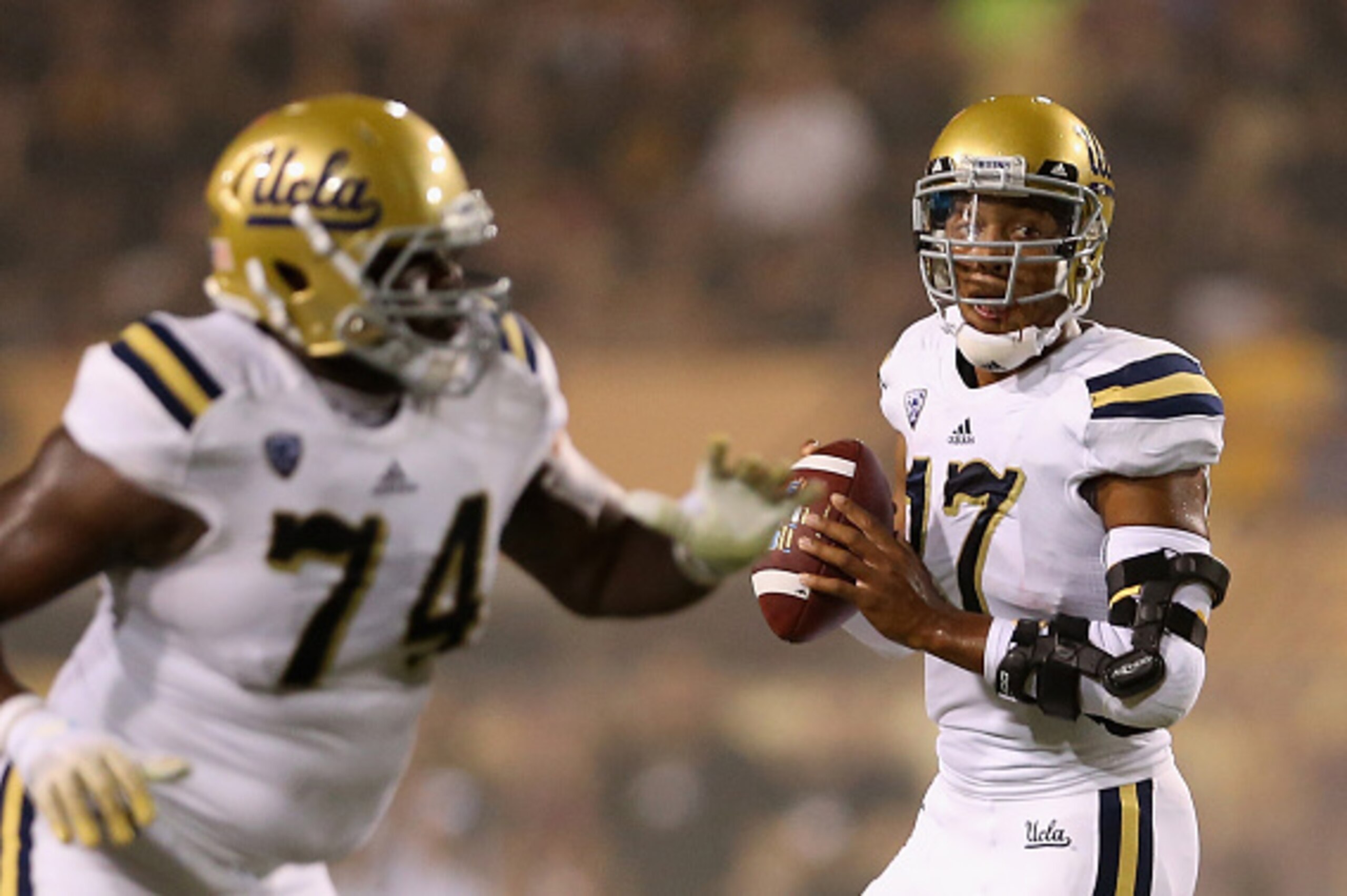 TEMPE, AZ - SEPTEMBER 25:  Quarterback Brett Hundley #17 of the UCLA Bruins drops back to pass during the college football game against the Arizona State Sun Devils at Sun Devil Stadium on September 25, 2014 in Tempe, Arizona. The Bruins defeated the Sun 