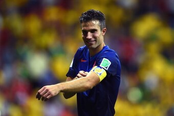 BRASILIA, BRAZIL - JULY 12:  Robin van Persie of the Netherlands takes off his captain armband after defeating Brazil 3-0 in the 2014 FIFA World Cup Brazil Third Place Playoff match between Brazil and the Netherlands at Estadio Nacional on July 12, 2014 i