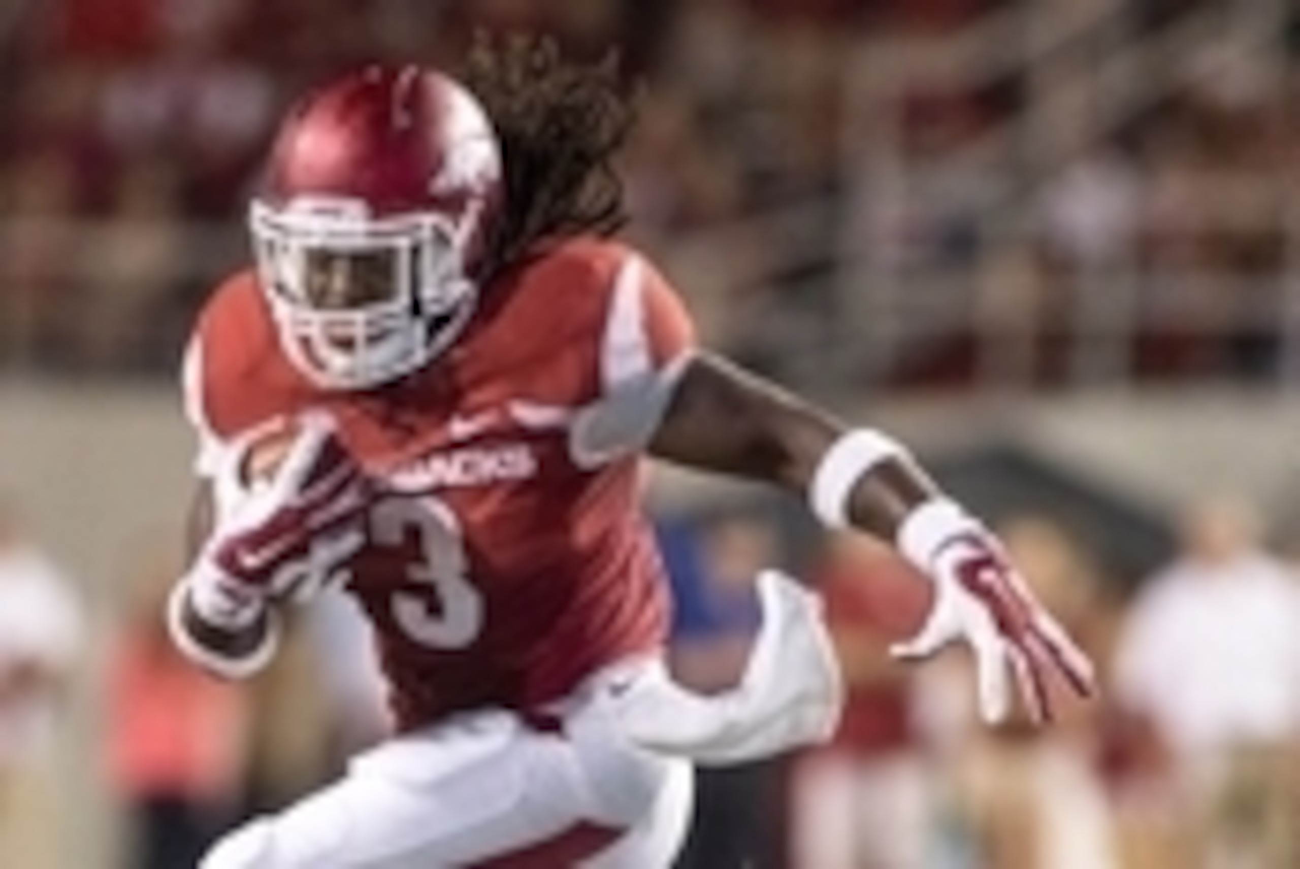 Sep 20, 2014; Fayetteville, AR, USA; Arkansas Razorbacks running back Alex Collins (3) carries the ball during the second half of a game against the Northern Illinois University Huskies at Donald W. Reynolds Razorback Stadium. Arkansas defeated NIU 52-14.