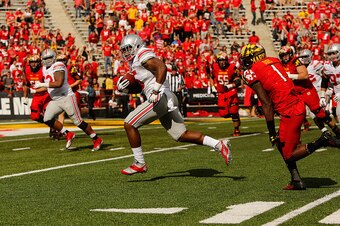 COLLEGE PARK, MD - OCTOBER 04:  Linebacker Raekwon McMillan #5 (C) of the Ohio State Buckeyes runs back an interception for a touchdown during the fourth quarter of a 52-24 Buckeyes win over the Maryland Terrapins at Byrd Stadium on October 4, 2014 in Col