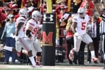 Oct 4, 2014; College Park, MD, USA; Ohio State Buckeyes linebacker Raekwon McMillan (5) celebrates after scoring a touchdown off a interception in the fourth quarter against the Maryland Terrapins at Byrd Stadium. Ohio State Buckeyes defeated Maryland Ter