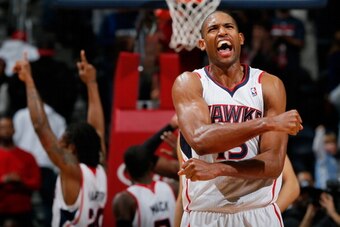 ATLANTA, GA - NOVEMBER 29:  Al Horford #15 of the Atlanta Hawks celebrates their 88-87 win over the Dallas Mavericks at Philips Arena on November 29, 2013 in Atlanta, Georgia.  NOTE TO USER: User expressly acknowledges and agrees that, by downloading and 