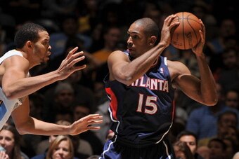 DENVER, CO - NOVEMBER 7: Al Horford #15 of the Atlanta Hawks looks to pass the ball against the Denver Nuggets on November 7, 2013 at the Pepsi Center in Denver, Colorado. NOTE TO USER: User expressly acknowledges and agrees that, by downloading and/or us
