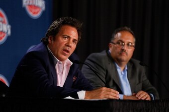 AUBURN HILLS, MI - MAY 15: Detroit Pistons owner Tom Gores (L) talks with new head coach and President of Basketball Operations Stan Van Gundy after a press conference to introduce Van Gundy at the Palace of Auburn Hills on May 15, 2014 in Auburn Hills, M