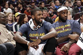 CLEVELAND, OH - OCTOBER 5:  Kyrie Irving #2 and LeBron James #23 of the Cleveland Cavaliers on the bench during the game against Maccabi Tel Aviv at The Quicken Loans Arena on October 16, 2014 in Cleveland, Ohio. NOTE TO USER: User expressly acknowledges 
