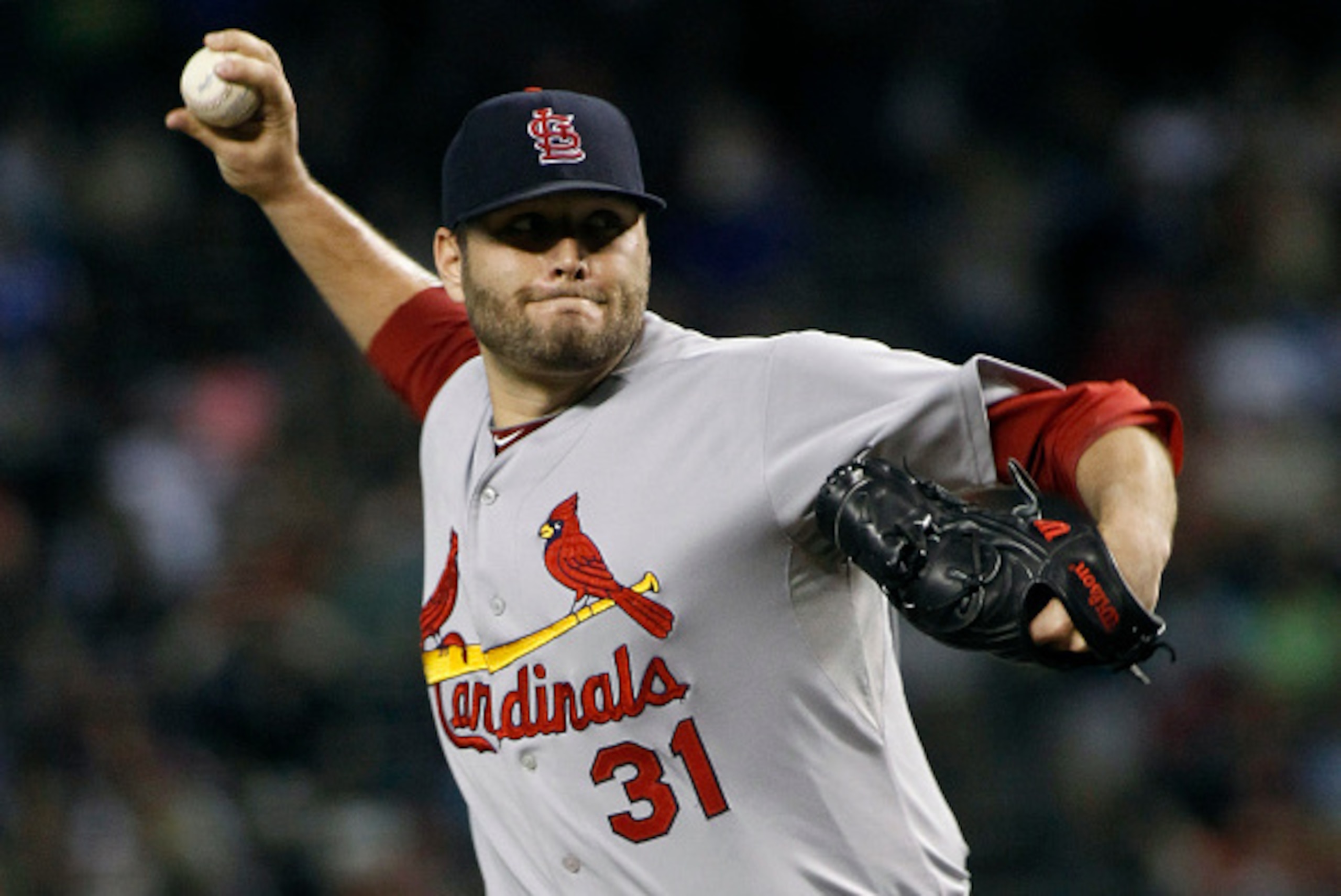 PHOENIX, AZ - SEPTEMBER 27:  Starting pitcher Lance Lynn #31 of the St Louis Cardinals delivers a pitch against the Arizona Diamondbacks during the first inning of a MLB game at Chase Field on September 27, 2014 in Phoenix, Arizona.  (Photo by Ralph Freso