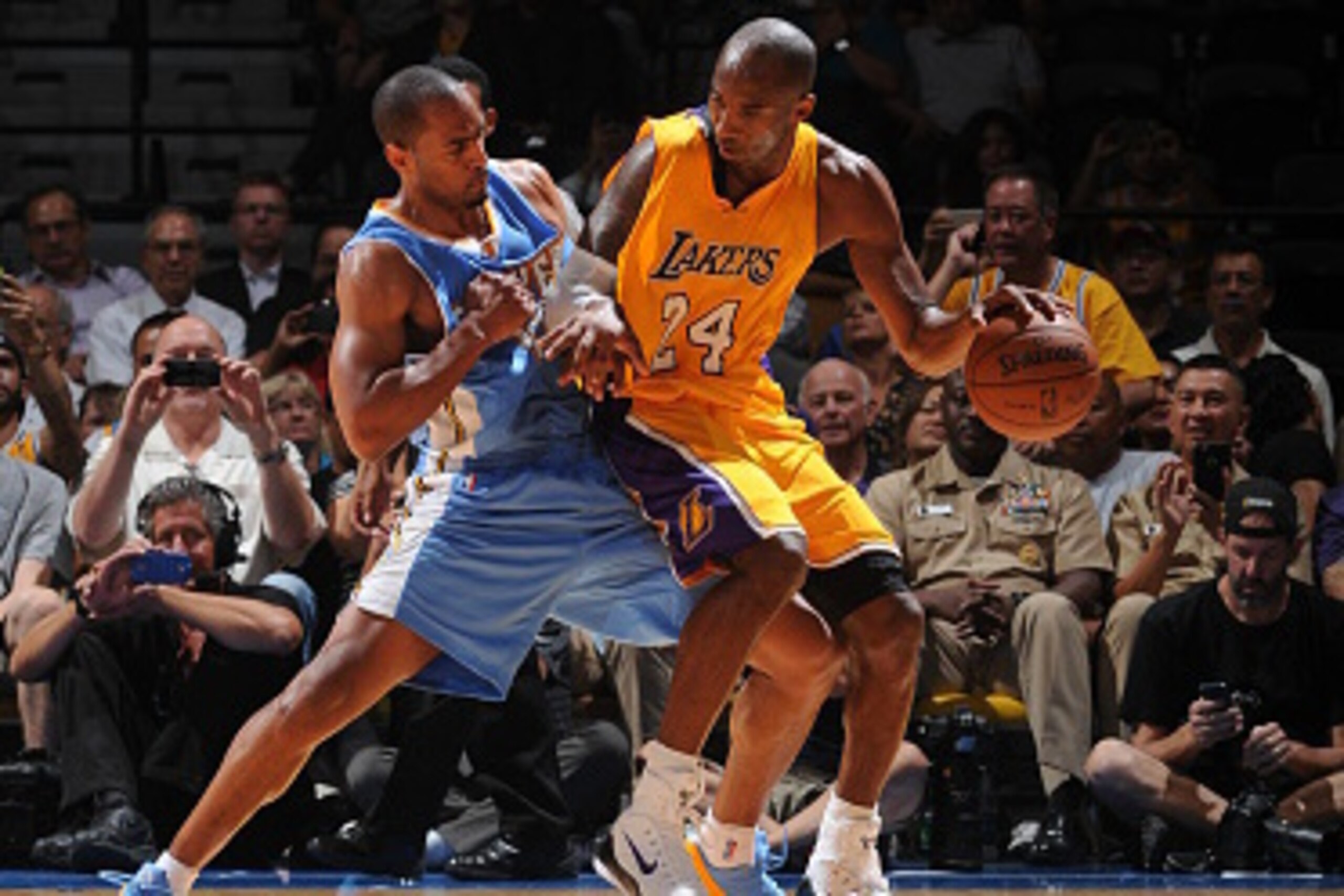 SAN DIEGO, CA- OCTOBER 6: Kobe Bryant #24 of the Los Angeles Lakers handles the ball against Arron Afflalo #10 of the Denver Nuggets as the Los Angeles Lakers take on the Denver Nuggets at the Valley View Sports Arena in San Diego, California on October 6