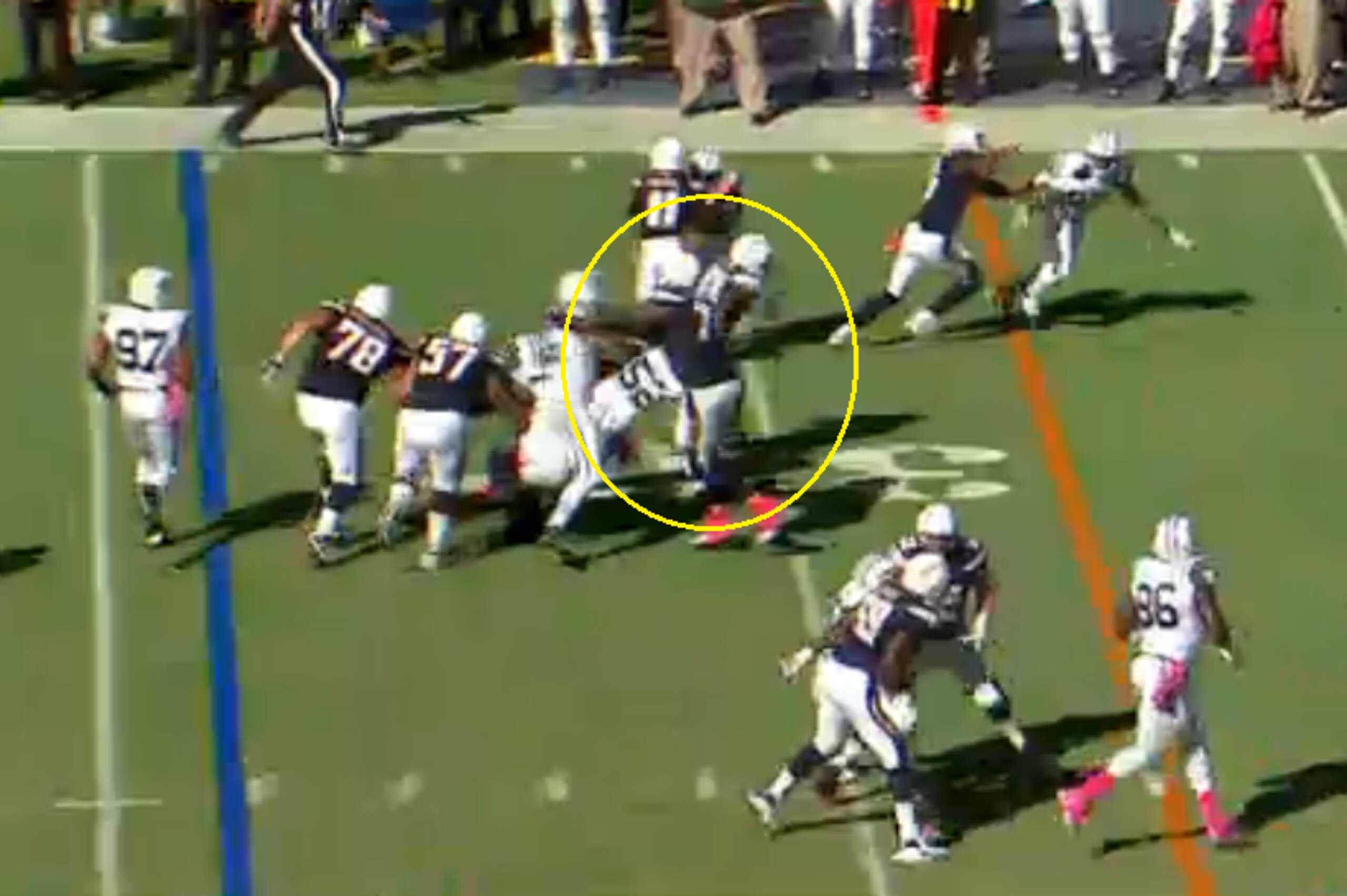 It's tough to see here, but Oliver gives No. 52 the stiff arm, showing off his underestimated strength.