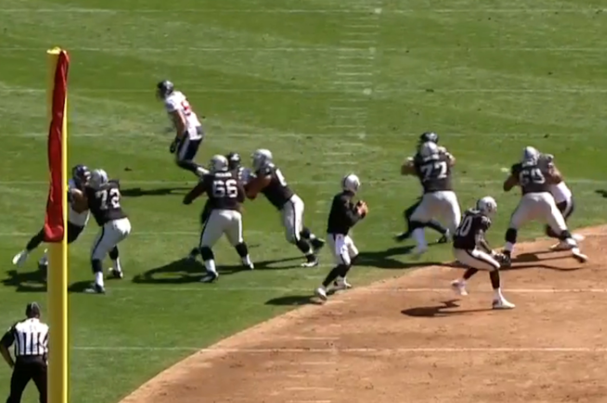 Four rushers are being occupied by the linemen, while a safety on the right begins his delayed blitz.