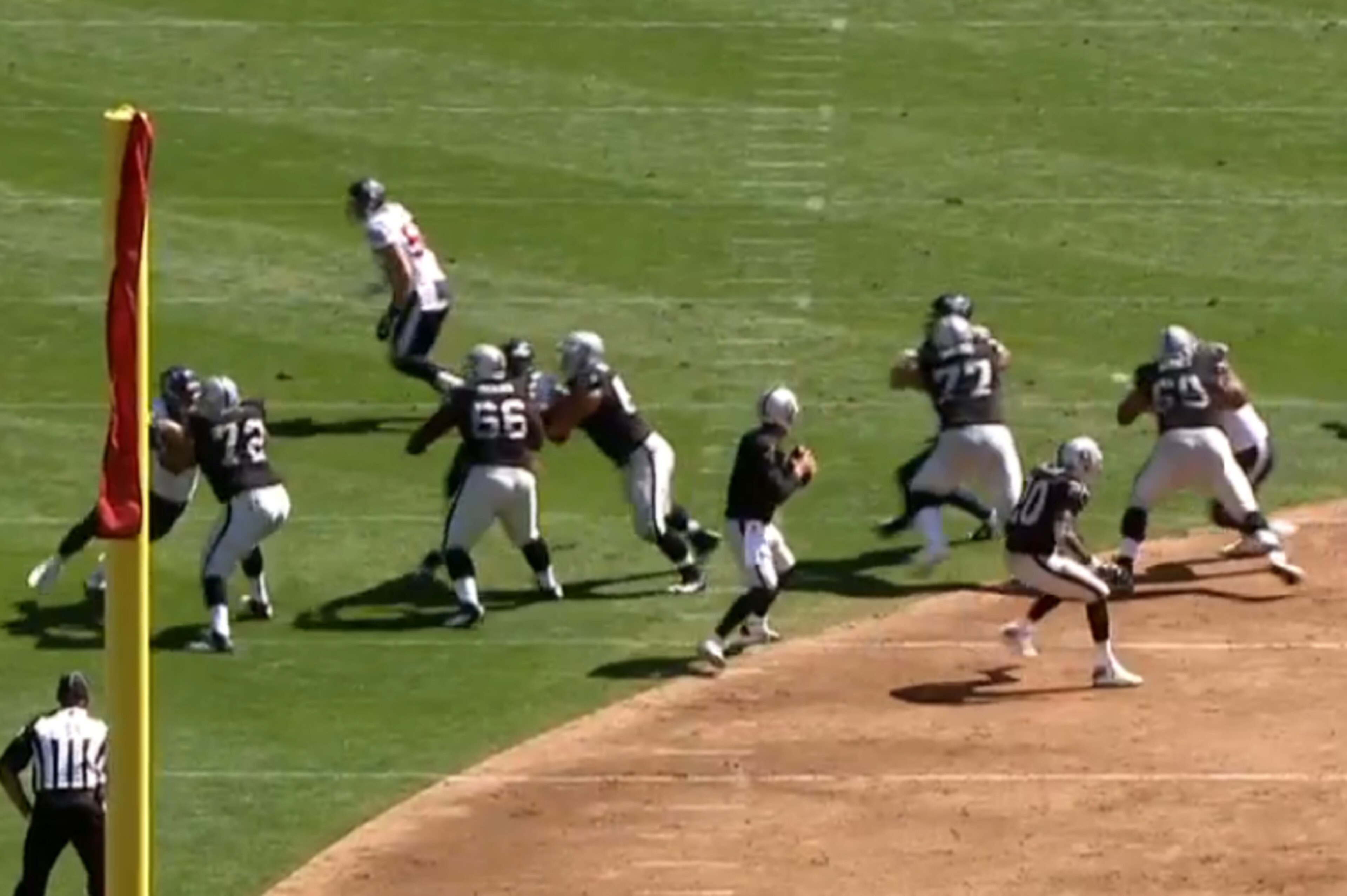 Four rushers are being occupied by the linemen, while a safety on the right begins his delayed blitz.