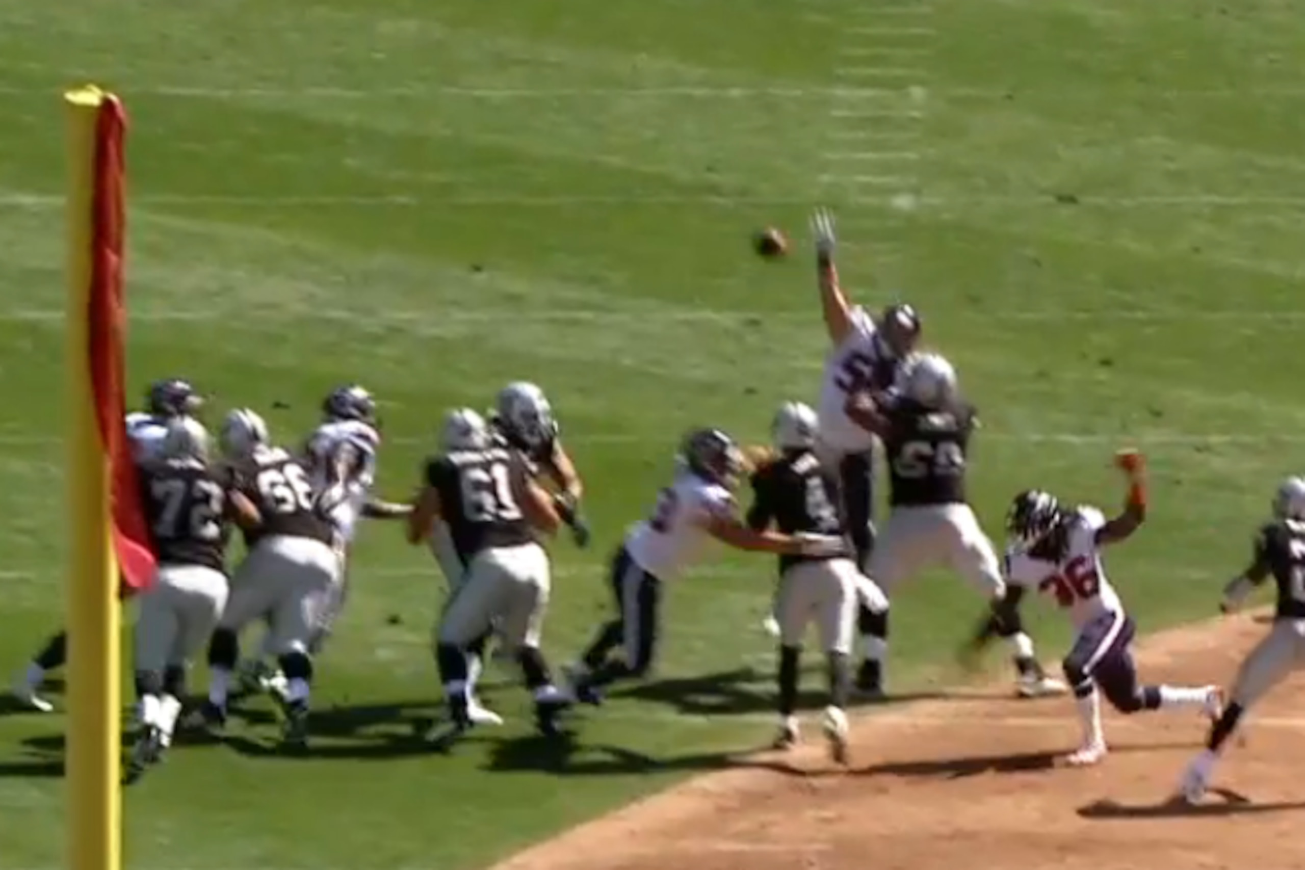 With pressure all around him, Carr looks to his left and heaves up a prayer instead of taking the sack.