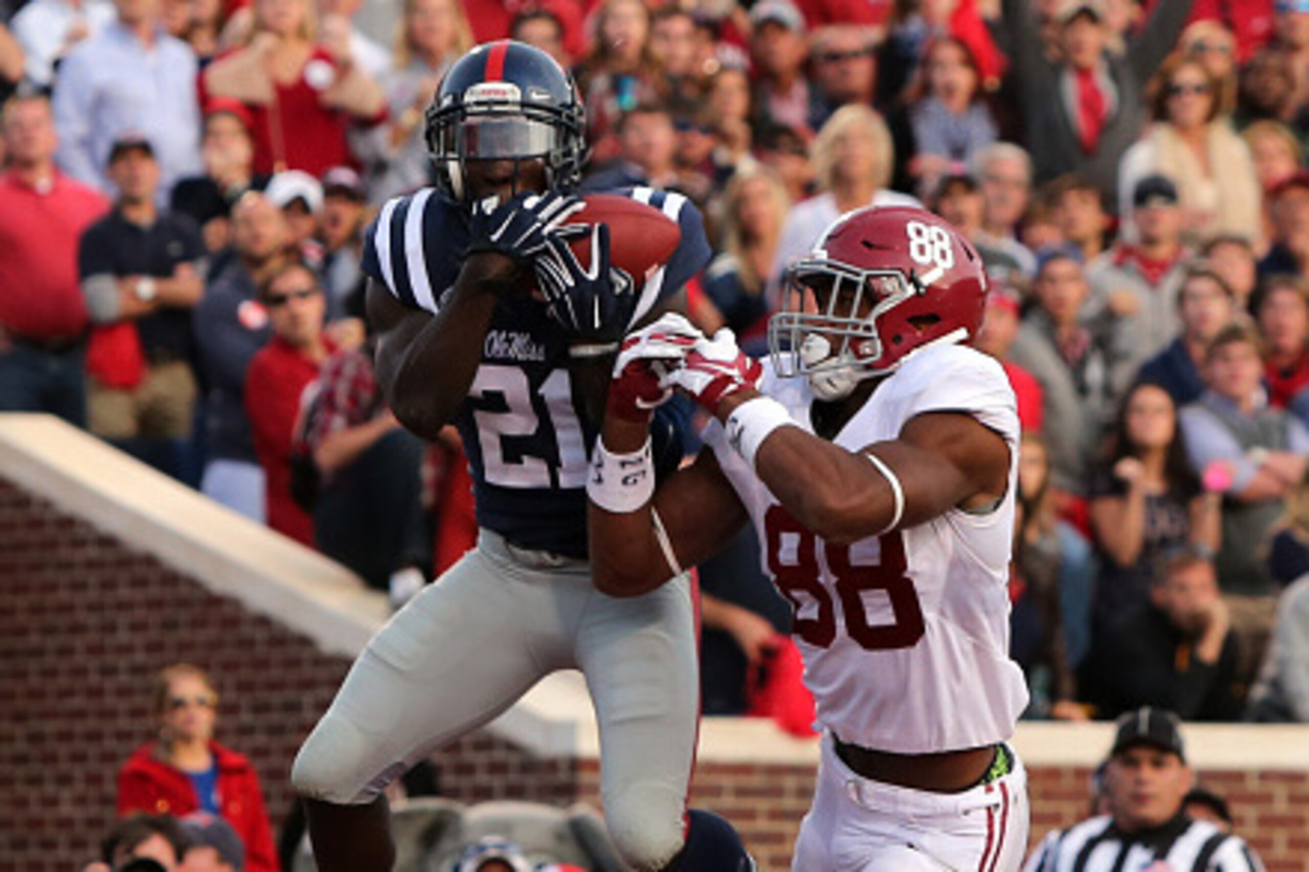 OXFORD, MS - OCTOBER 4: Senquez Golson #21 of the Ole Miss Rebels intercepts a pass attempt in the endzone against O.J. Howard #88 of the Alabama Crimson Tide on OCTOBER 4, 2014 at Vaught-Hemingway Stadium in Oxford, Mississippi. Mississippi beat Alabama 