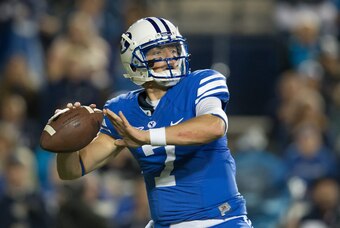 Oct 3, 2014; Provo, UT, USA; Brigham Young Cougars quarterback Christian Stewart (7) passes the ball during the second half against the Utah State Aggies at Lavell Edwards Stadium. Utah State won 35-20. Mandatory Credit: Russ Isabella-USA TODAY Sports