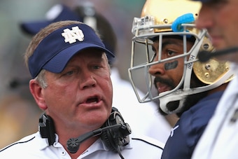 SOUTH BEND, IN - AUGUST 30:  Head coach Brian Kelly of the Notre Dame Fighting Irish talks to Matthias Farley #41 against the Rice Owls at Notre Dame Stadium on August 30, 2014 in South Bend, Indiana. Notre Dame defeated Rice 48-17.  (Photo by Jonathan Da