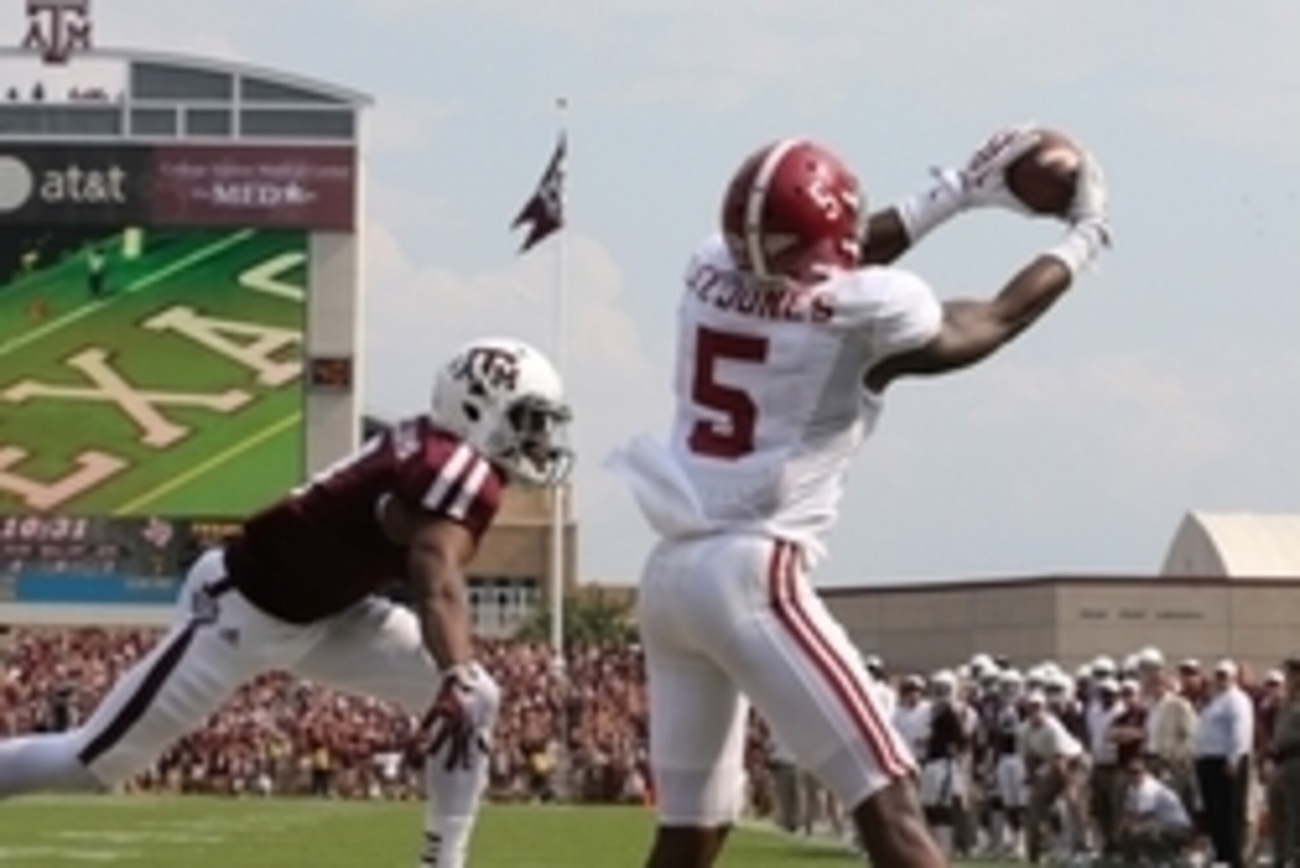Sep 14, 2013; College Station, TX, USA; Alabama Crimson Tide cornerback Cyrus Jones (5) intercepts the ball in the end zone in the second quarter against Texas A&M Aggies receiver Ja'Quay Williams (4) at Kyle Field. Mandatory Credit: Matthew Emmons-USA TO