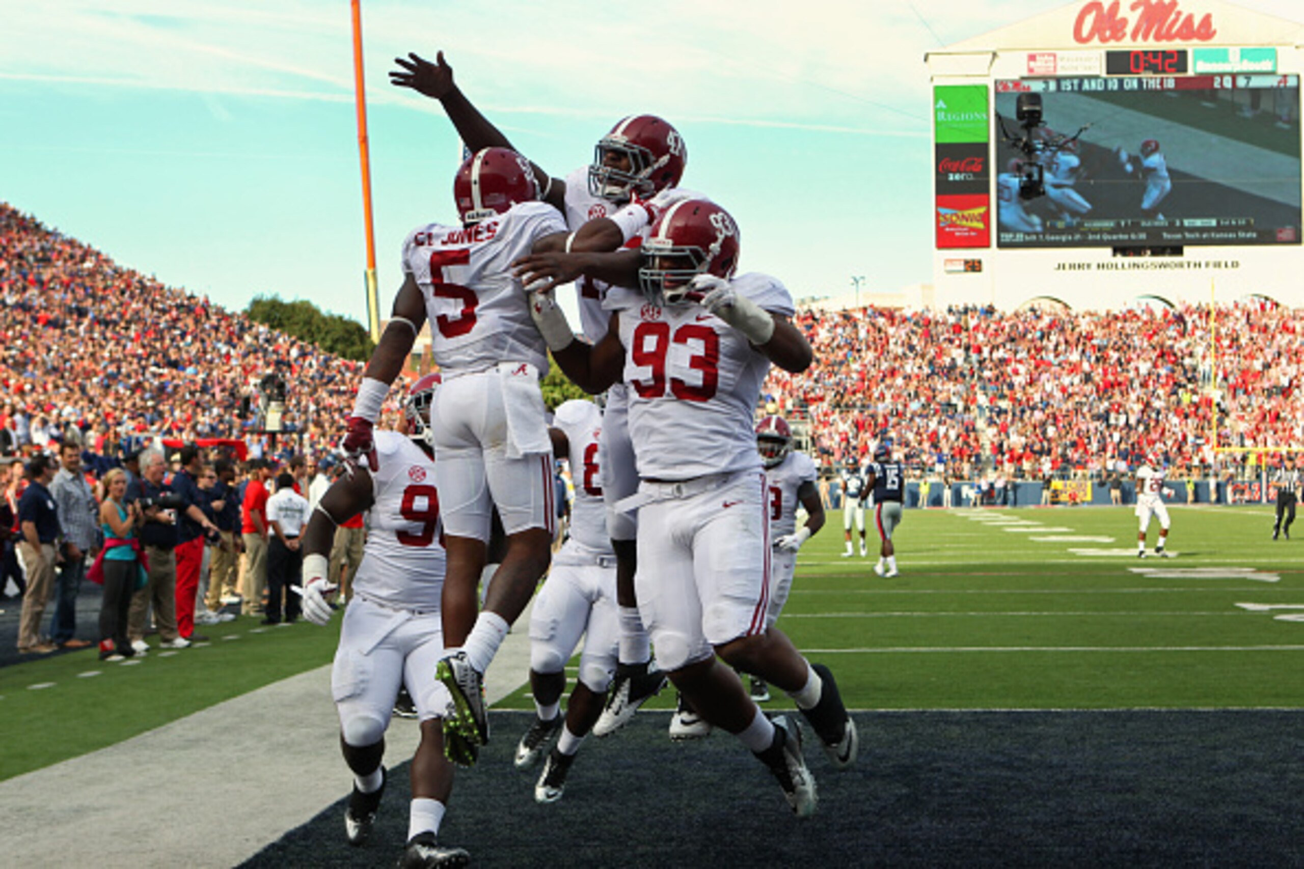 OXFORD, MS - OCTOBER 4: Cyrus Jones #5 of the Alabama Crimson Tide celebrates his touchdown with Xzavier Dickson #47 and Jonathan Allen #93 against the Ole Miss Rebels  on October 4, 2014 at Vaught-Hemingway Stadium in Oxford, Mississippi.  (Photo by Joe 