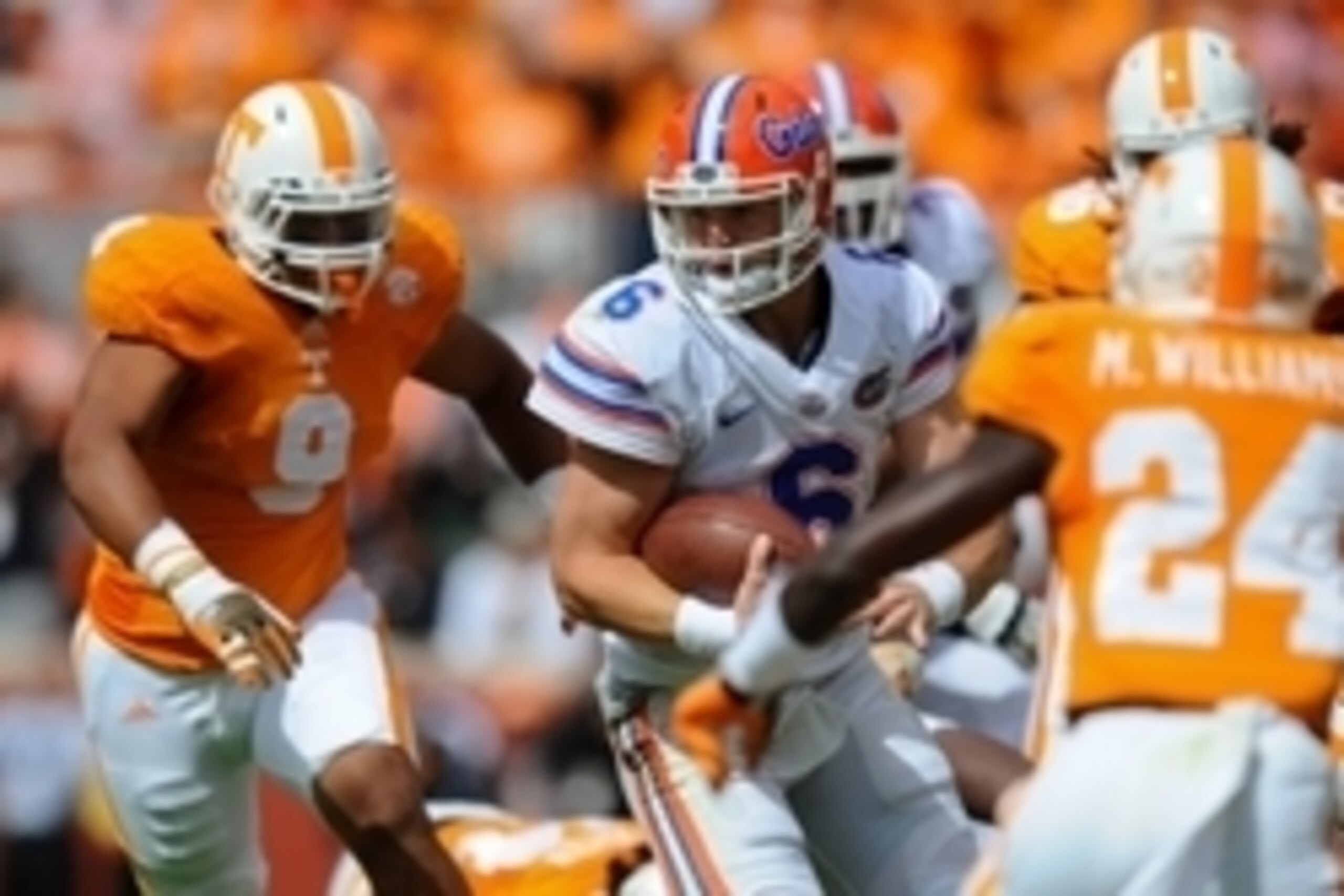 Oct 4, 2014; Knoxville, TN, USA; Florida Gators quarterback Jeff Driskel (6) carries the ball as Tennessee Volunteers defensive end Derek Barnett (9) chases during the first quarter at Neyland Stadium. Mandatory Credit: Randy Sartin-USA TODAY Sports