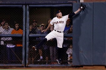 SAN FRANCISCO, CA - OCTOBER 07:  Hunter Pence #8 of the San Francisco Giants catches a ball hit by Jayson Werth #28 of the Washington Nationals for an out in the sixth inning during Game Four of the National League Division Series at AT&T Park on October