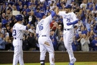 Oct 5, 2014; Kansas City, MO, USA; Kansas City Royals first baseman Eric Hosmer (35) celebrates with designated hitter Billy Butler (16) and right fielder Norichika Aoki (23) after hitting a home run against the Los Angeles Angels in the third inning of g