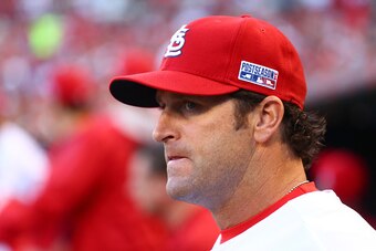 ST LOUIS, MO - OCTOBER 07:  Manager Mike Matheny #22 of the St. Louis Cardinals looks on from the dugout against the Los Angeles Dodgers in Game Four of the National League Divison Series at Busch Stadium on October 7, 2014 in St Louis, Missouri.  (Photo