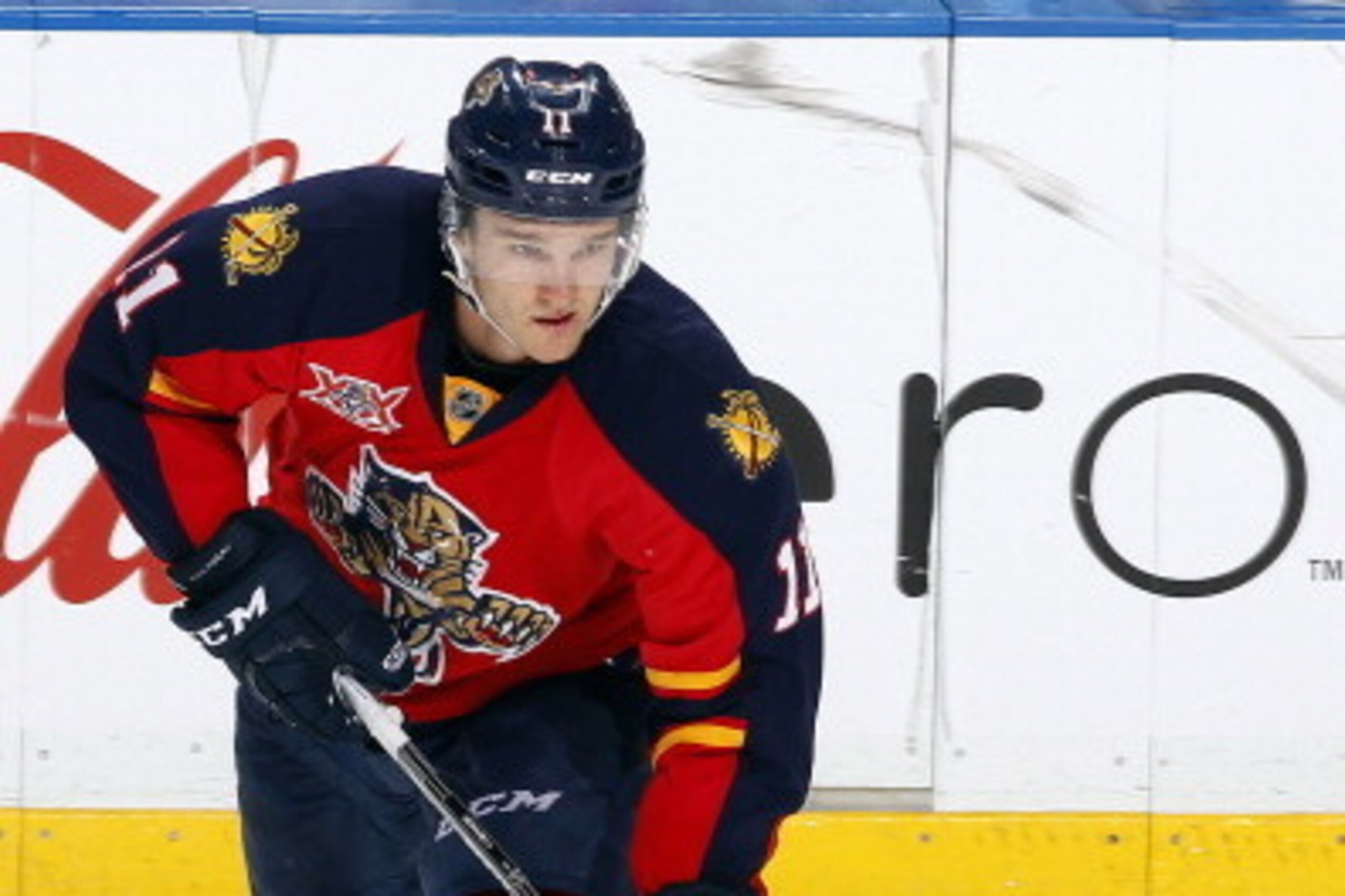 SUNRISE, FL - MARCH 14: Jonathan Huberdeau #11 of the Florida Panthers skates for the puck against the New Jersey Devils at the BB&T Center on March 14, 2014 in Sunrise, Florida. (Photo by Eliot J. Schechter/NHLI via Getty Images)