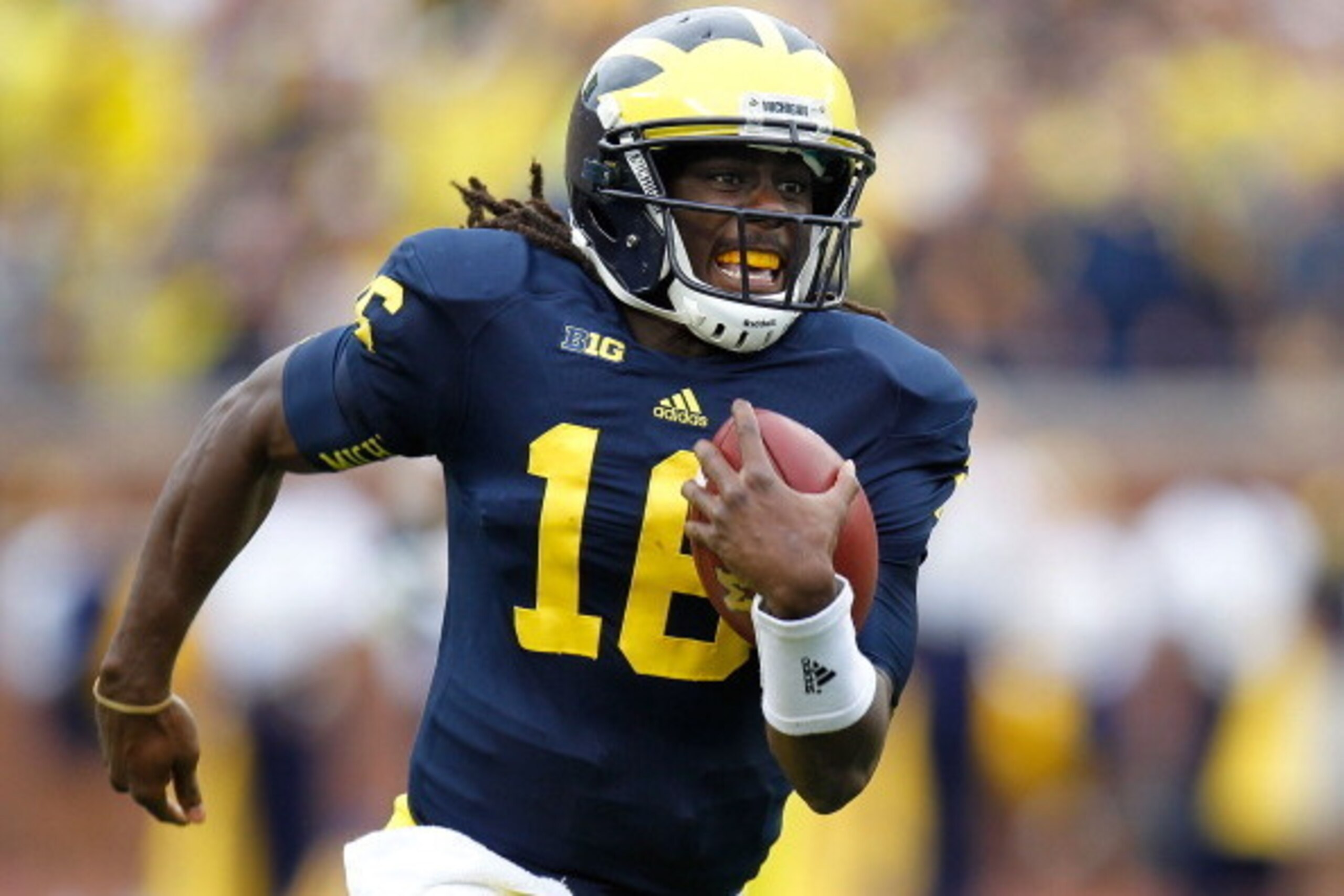 ANN ARBOR, MI - SEPTEMBER 08:  Denard Robinson #16 of the Michigan Wolverines runs for a third quarter touchdown while playing the Air Force Falcons at Michigan Stadium on September 8, 2012 in Ann Arbor, Michigan. (Photo by Gregory Shamus/Getty Images)