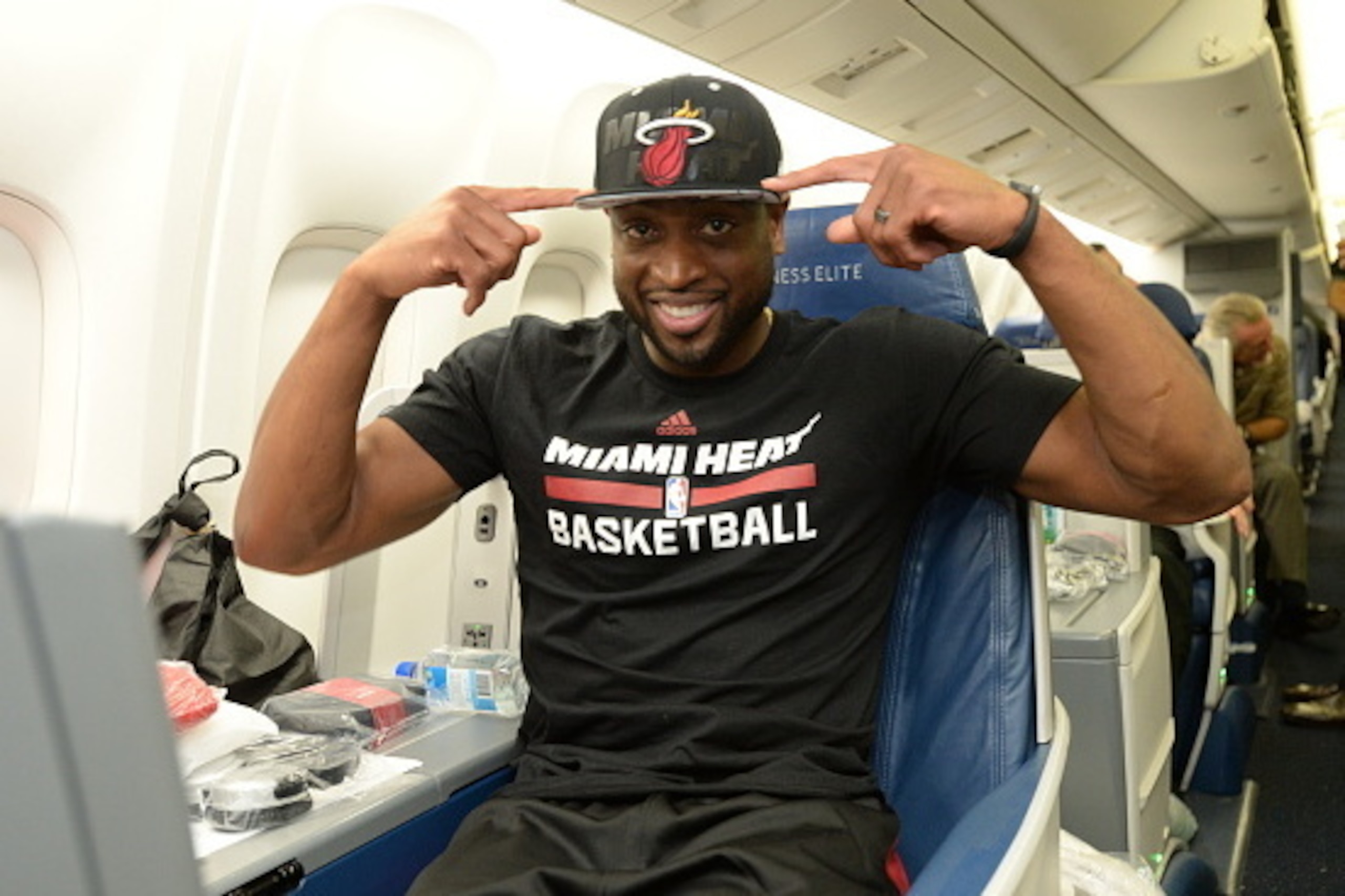 MIAMI, FL - OCTOBER 7:  Dwyane Wade #3 of the Miami Heat on the plane for a flight to Rio de Janeiro as a part of NBA Global Games at the Miami International Airport on October 7, 2014 in Miami, Florida.  NOTE TO USER:  User expressly acknowledges and agr