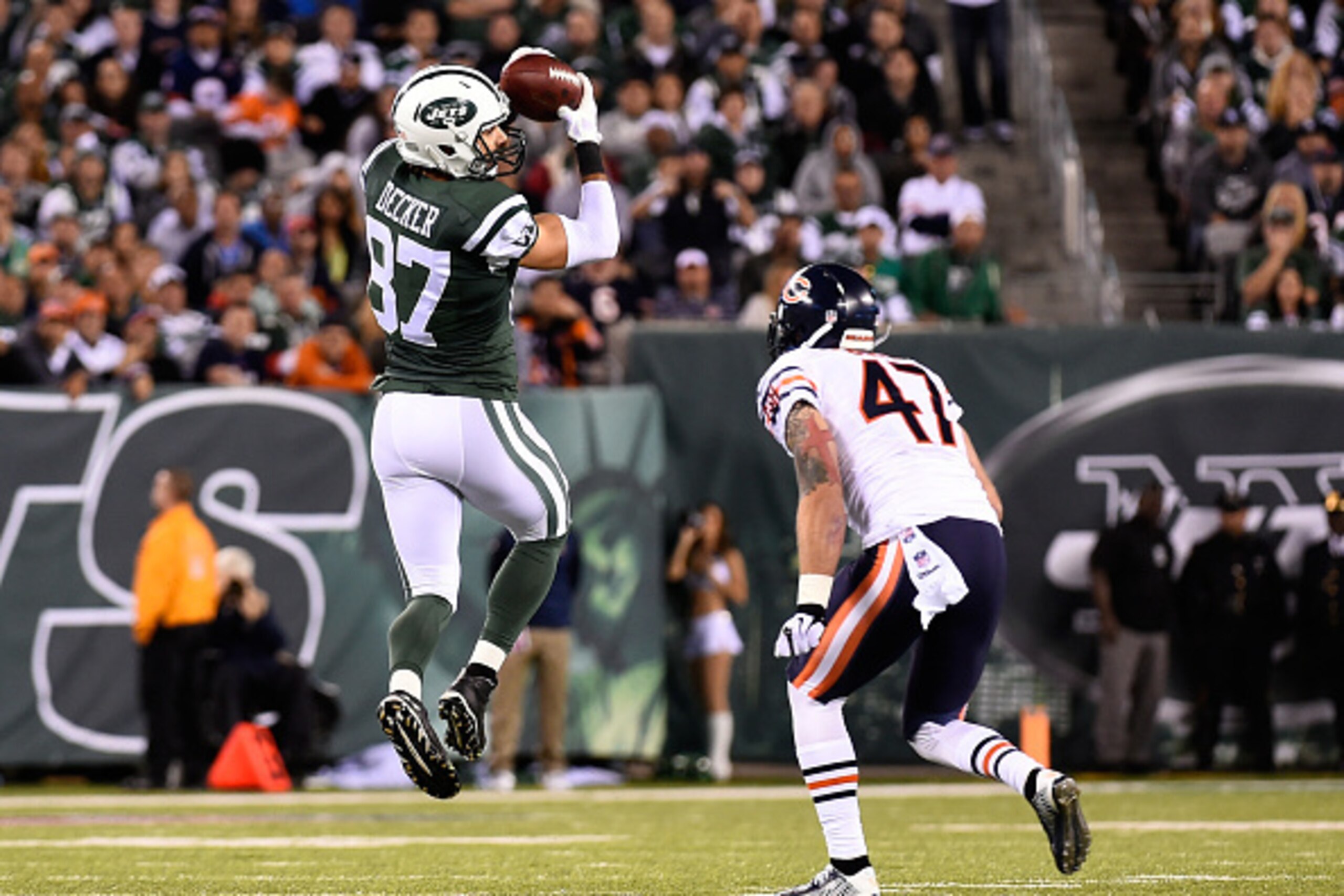 EAST RUTHERFORD, NJ - SEPTEMBER 22: Wide receiver Eric Decker #87 of the New York Jets makes a catch as free safety Chris Conte #47 of the Chicago Bears defends during a game at MetLife Stadium on September 22, 2014 in East Rutherford, New Jersey.  (Photo
