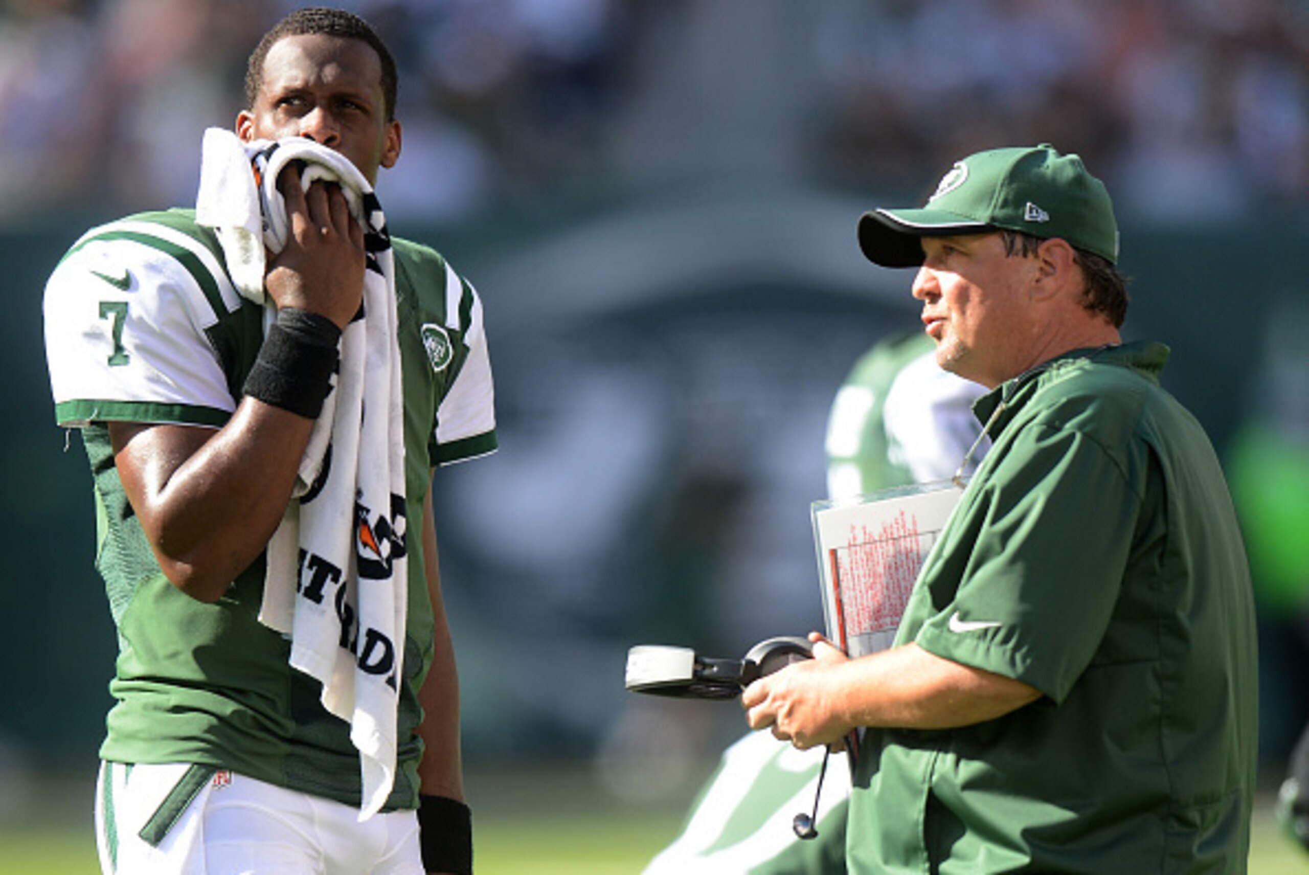 EAST RUTHERFORD, NJ - SEPTEMBER 28:  Geno Smith #7 of the New York Jets talks to Offensive Coordinator Marty Mornhinweg in the fourth quarter of their 24 to 17 loss to the Detroit Lions at MetLife Stadium on September 28, 2014 in East Rutherford, New Jers