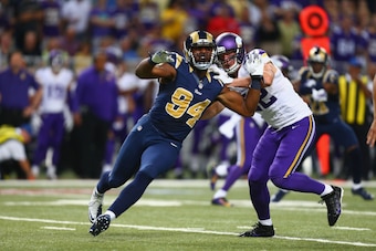 ST. LOUIS, MO - SEPTEMBER 7: Robert Quinn #94 of the St. Louis Rams rushes past Kyle Rudolph #82 of the Minnesota Vikings at the Edward Jones Dome on September 7, 2014 in St. Louis, Missouri.  The Vikings beat the Rams 34-6.  (Photo by Dilip Vishwanat/Get