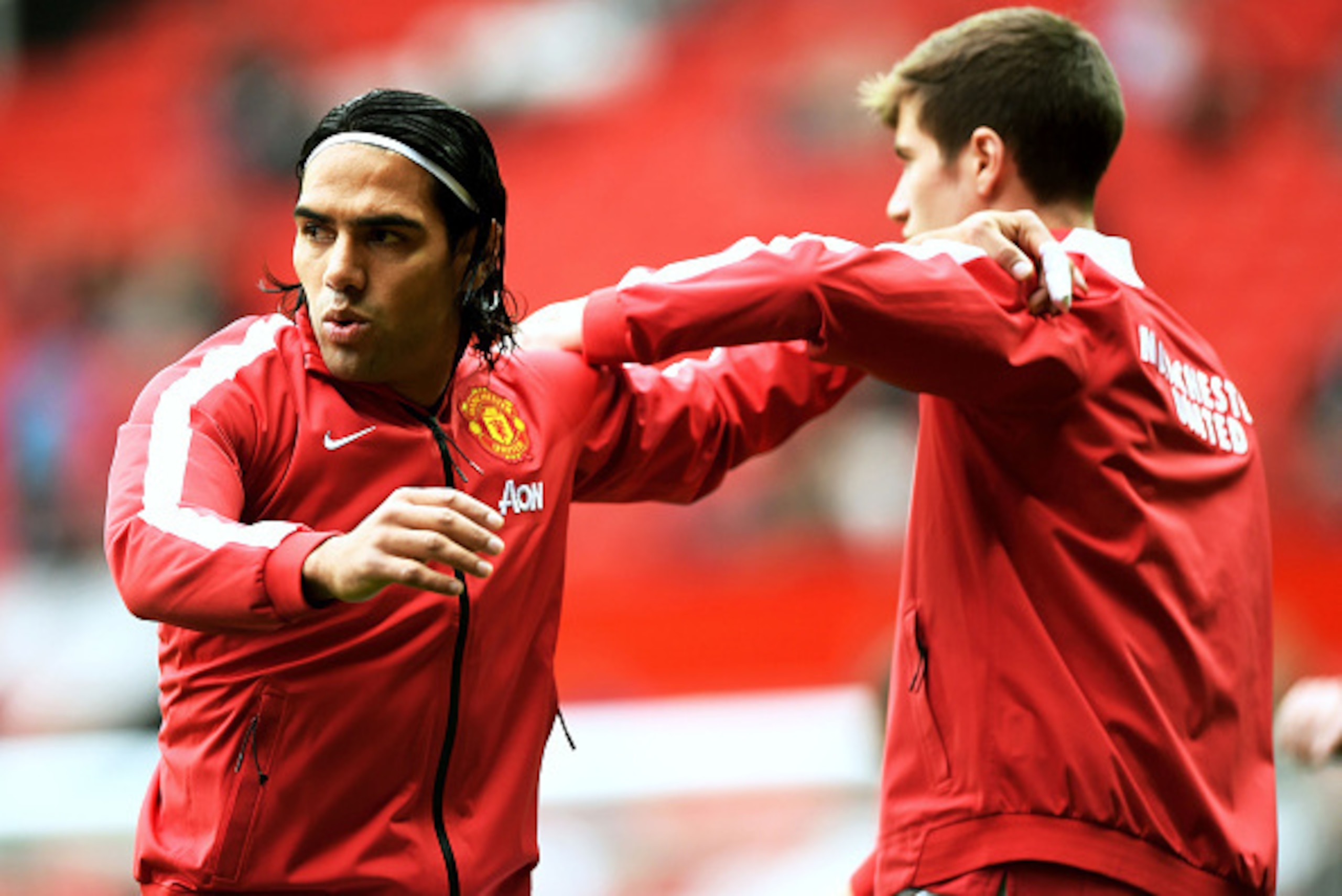 MANCHESTER, ENGLAND - SEPTEMBER 27:  Radamel Falcao Garcia of Manchester United warms up with team-mate Paddy McNair before the Barclays Premier League match between Manchester United and West Ham United at Old Trafford on September 27, 2014 in Manchester