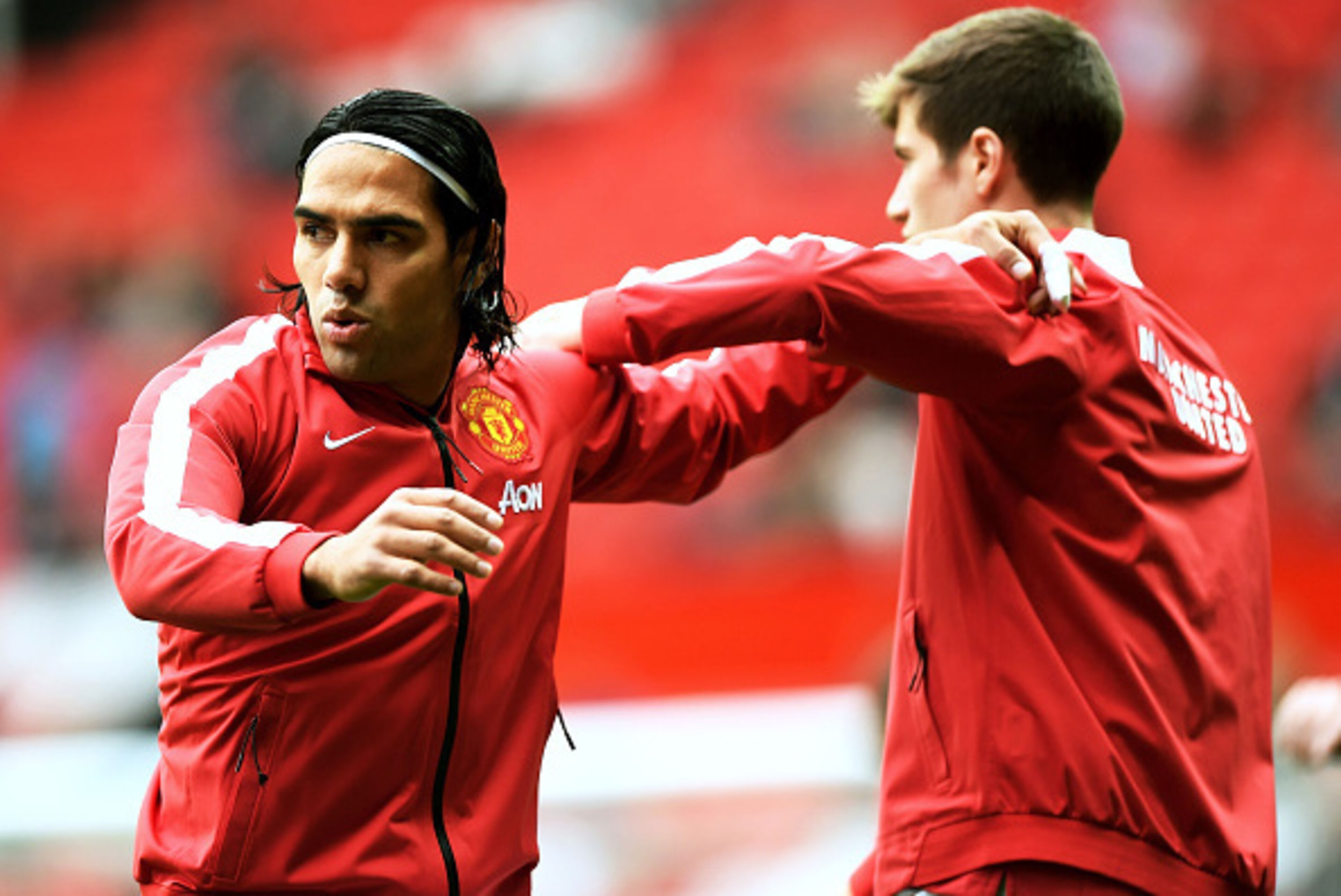 MANCHESTER, ENGLAND - SEPTEMBER 27:  Radamel Falcao Garcia of Manchester United warms up with team-mate Paddy McNair before the Barclays Premier League match between Manchester United and West Ham United at Old Trafford on September 27, 2014 in Manchester