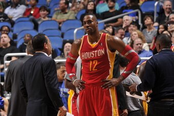 ORLANDO, FL - MARCH 5: Dwight Howard #12 of the Houston Rockets gets direction against the Orlando Magic during the game on March 5, 2014 at Amway Center in Orlando, Florida. NOTE TO USER: User expressly acknowledges and agrees that, by downloading and or
