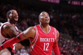 PORTLAND, OR - APRIL 27: Dwight Howard #12 of the Houston Rockets battles for position against LaMarcus Aldridge #12 of the Portland Trail Blazers in Game Four of the Western Conference Quarterfinals during the 2014 NBA Playoffs on April 27, 2014 at the M