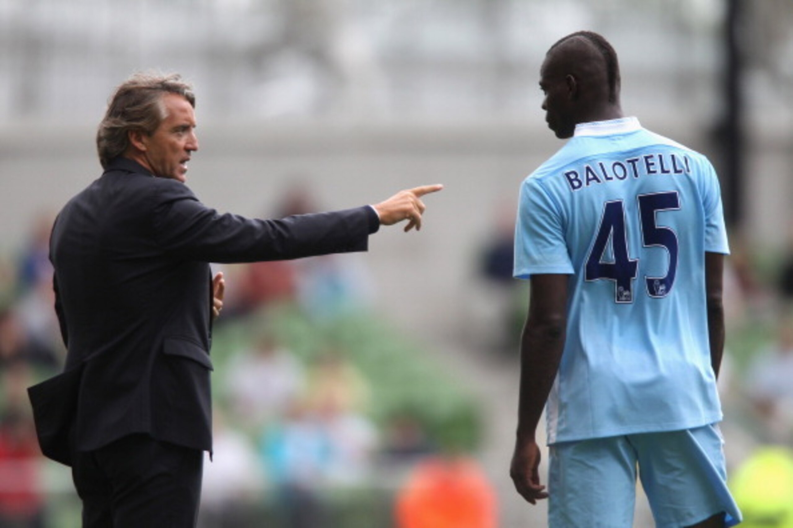 DUBLIN, IRELAND - JULY 31:  Roberto Mancini, the Manchester City manager issues instructions to Mario Balotelli during the Dublin Super Cup match between Inter Milan and Manchester City at the Aviva Stadium on July 31, 2011 in Dublin, Ireland.  (Photo by 