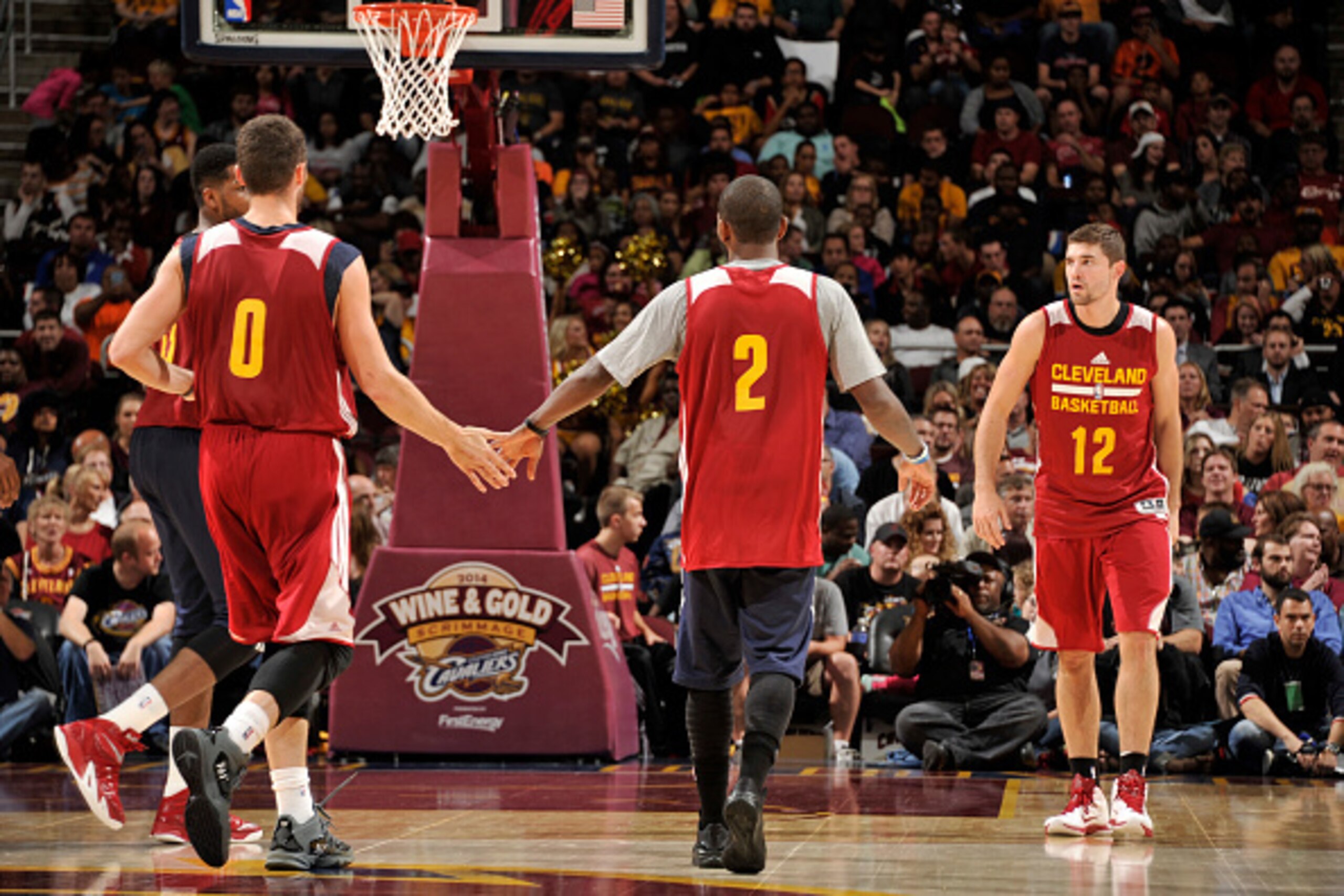 CLEVELAND, OH - OCTOBER 1:  Kevin Love #0 and Kyrie Irving #2 of the Cleveland Cavaliers congratulate each other during a scrimmage at The Quicken Loans Arena on October 1, 2014 in Independence, Ohio. NOTE TO USER: User expressly acknowledges and agrees t