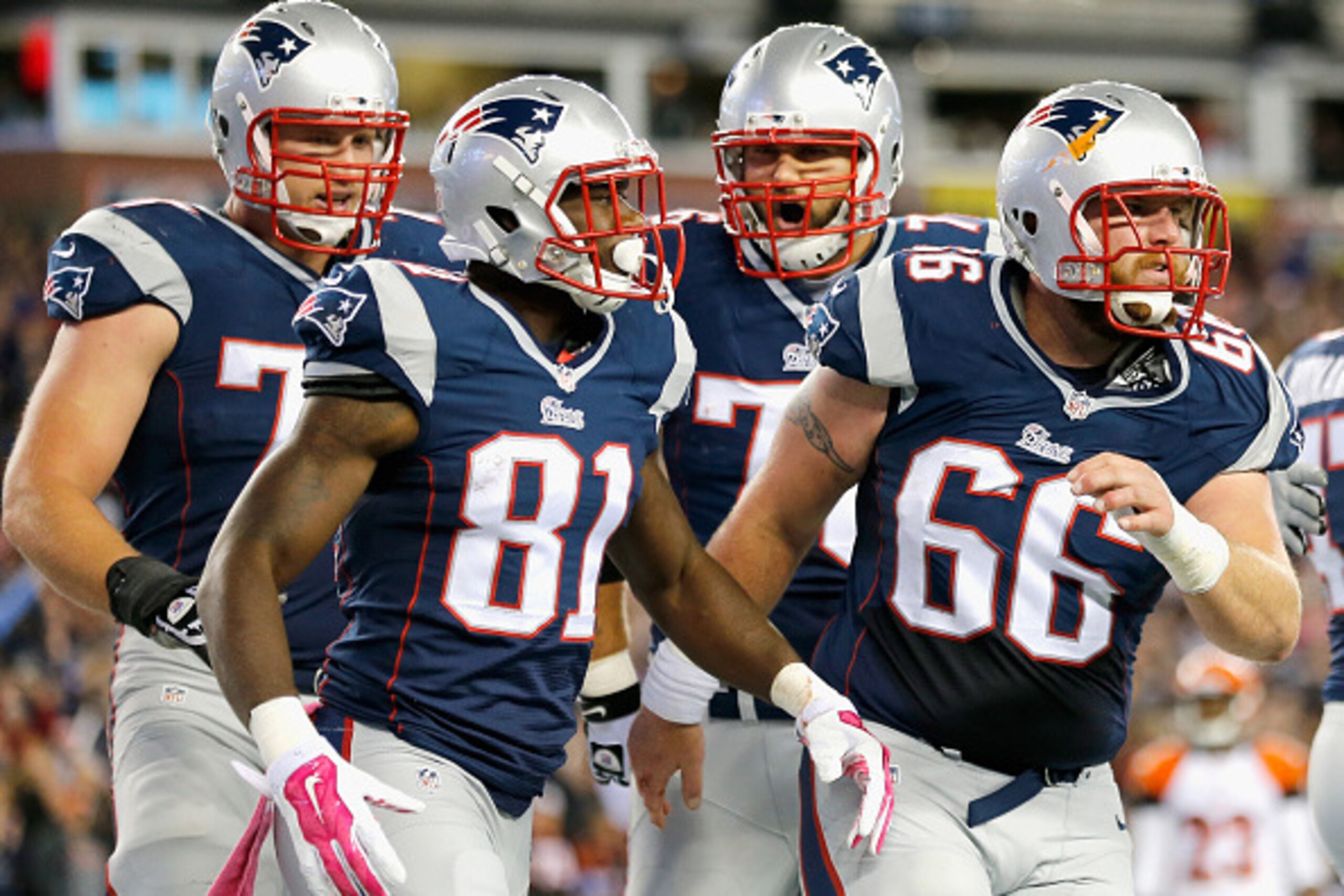 FOXBORO, MA - OCTOBER 05:  Tim Wright #81 of the New England Patriots celebrates alongside teammates after scoring a touchdown during the first quarter against the Cincinnati Bengals at Gillette Stadium on October 5, 2014 in Foxboro, Massachusetts.  (Phot