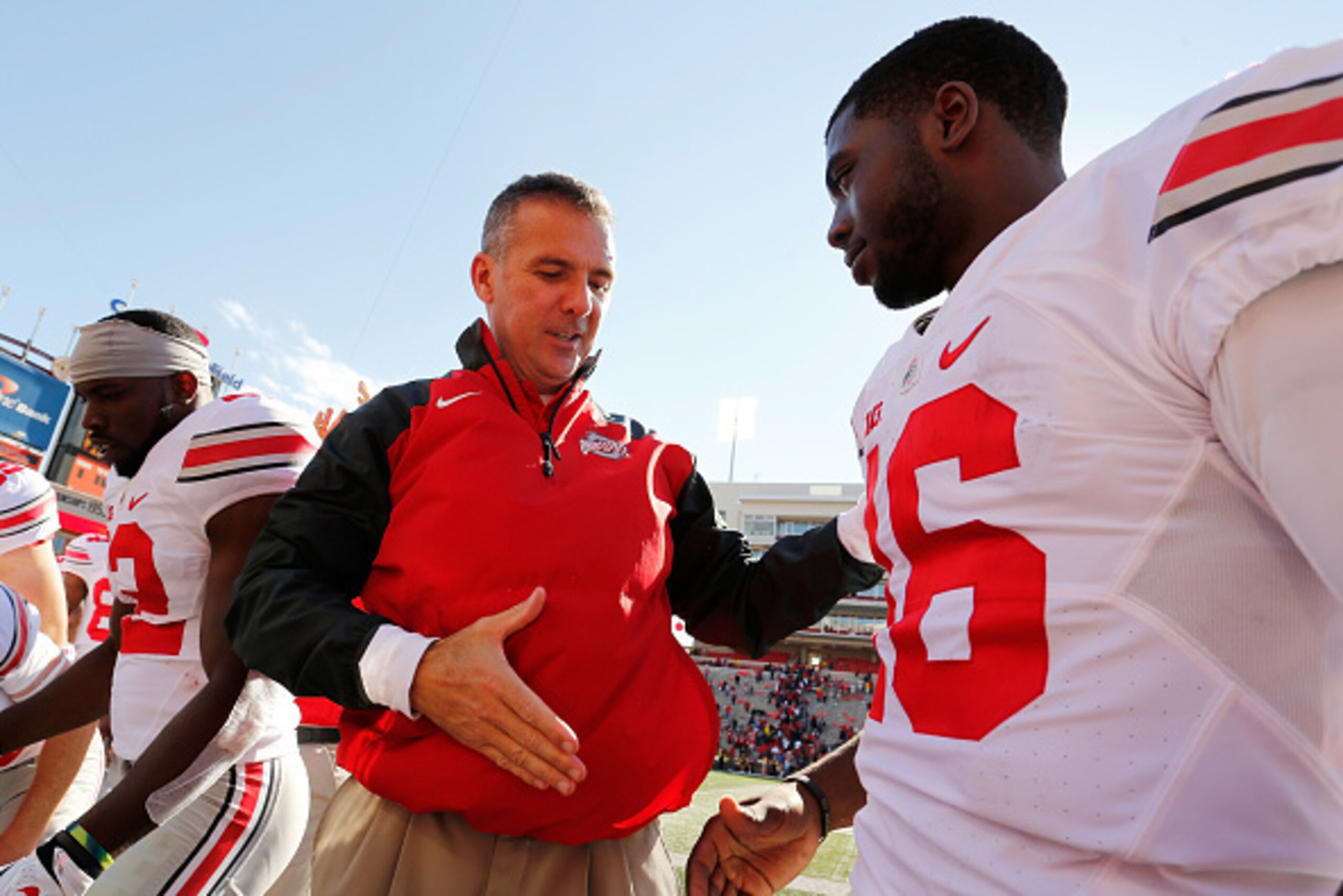 COLLEGE PARK, MD - OCTOBER 04: Head coach Urban Meyer of the Ohio State Buckeyes (L) shakes hands with quarterback J.T. Barrett #16 (R) after their 52-24 win over the Maryland Terrapins at Byrd Stadium on October 4, 2014 in College Park, Maryland. (Phot COLLEGE PARK, MD - OCTOBER 04: Head coach Urban Meyer of the Ohio State Buckeyes (L) shakes hands with quarterback J.T. Barrett #16 (R) after their 52-24 win over the Maryland Terrapins at Byrd Stadium on October 4, 2014 in College Park, Maryland. (Phot