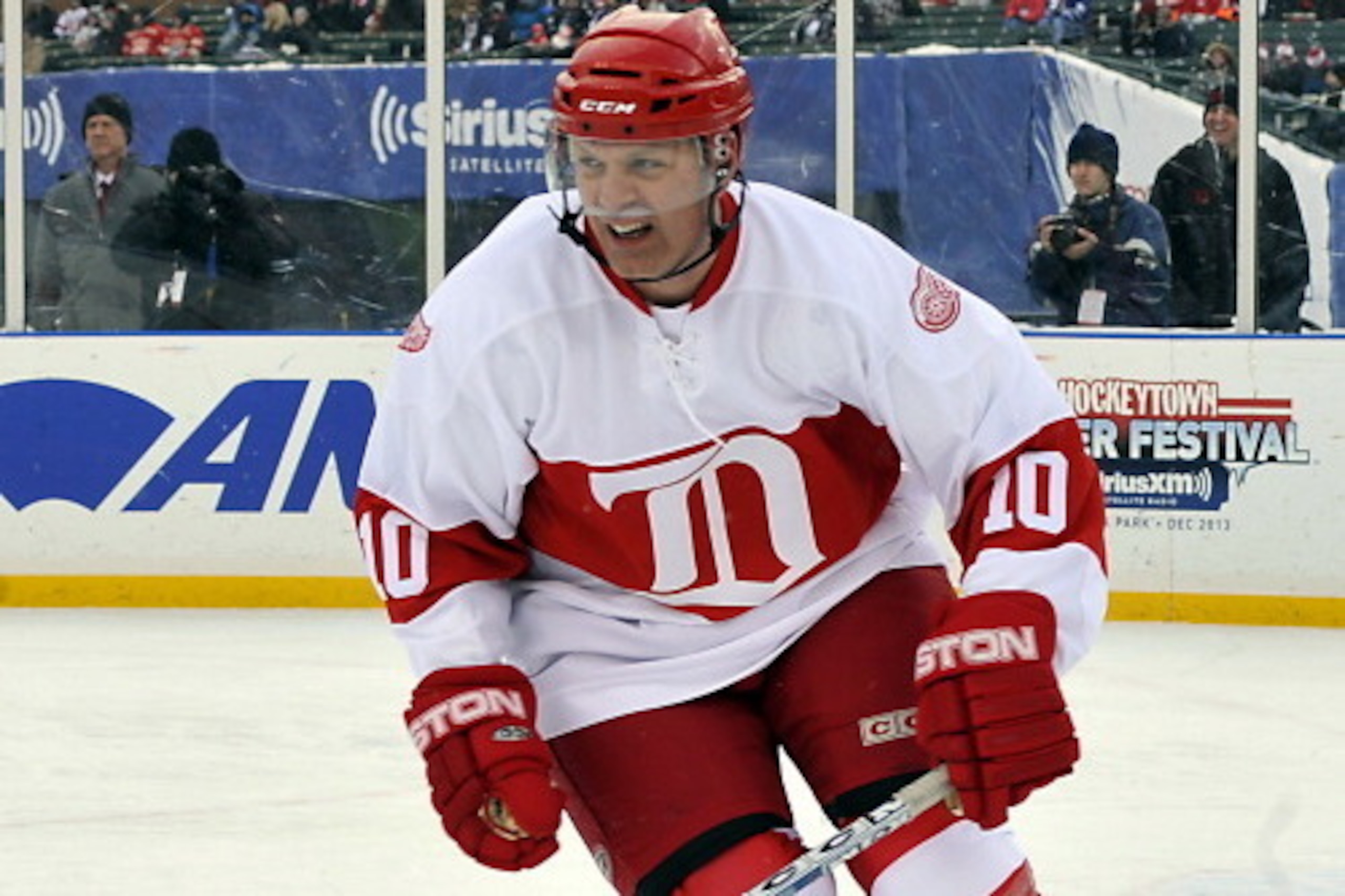 DETROIT, MI - DECEMBER 31: Jimmy Carson #10 of the Detroit Red Wings Alumni turns up ice against the Toronto Maple Leaf Alumni during game action on December 31, 2013 at Comerica Park in Detroit, Michigan. (Photo by Graig Abel/NHLI  via Getty Images)