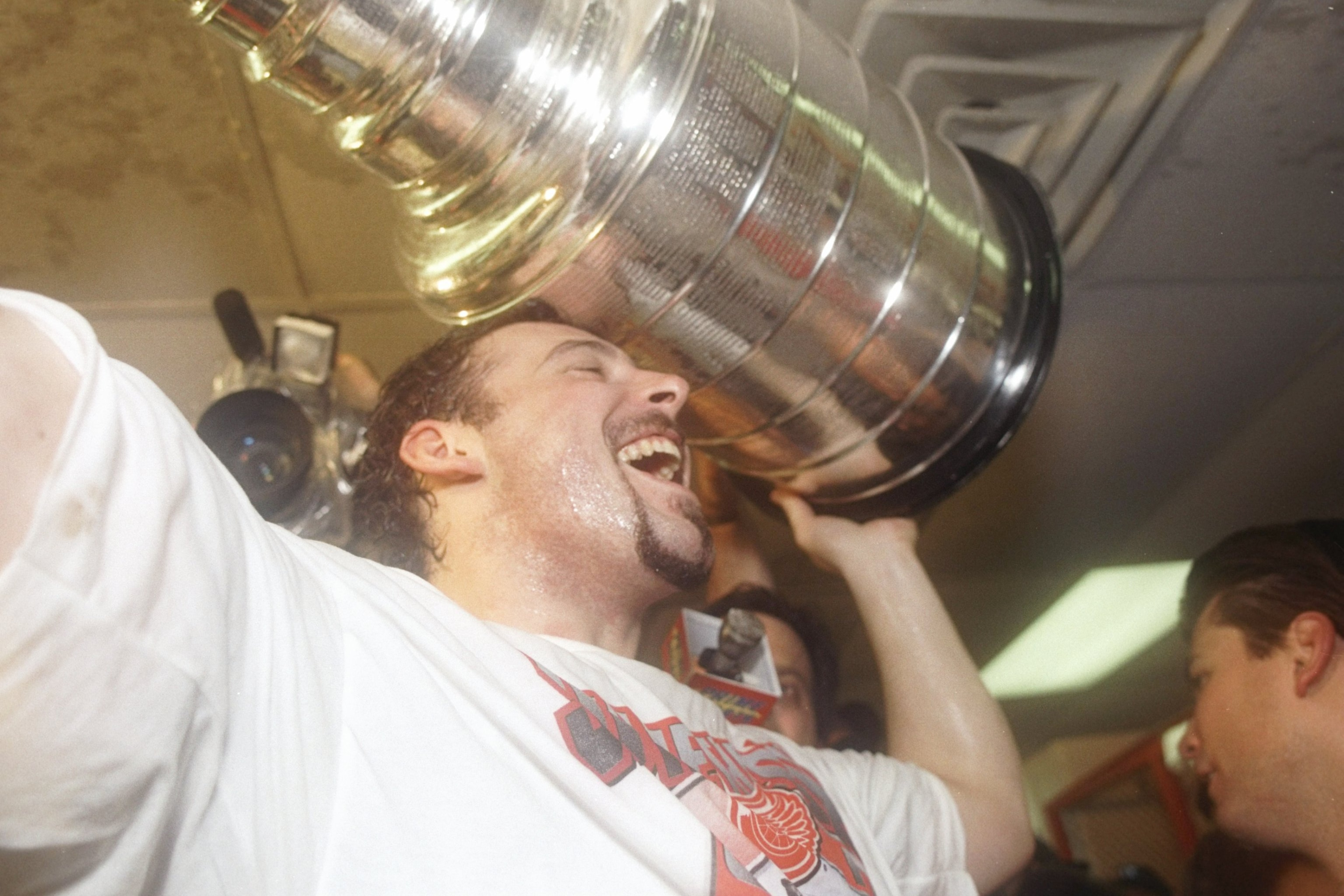 7 Jun 1997: Detroit Red Wings center Martin LaPointe raises the Stanley Cup over his head at the Joe Louis Arena in Detroit, Michigan. The Red Wings won the game 2-1.
